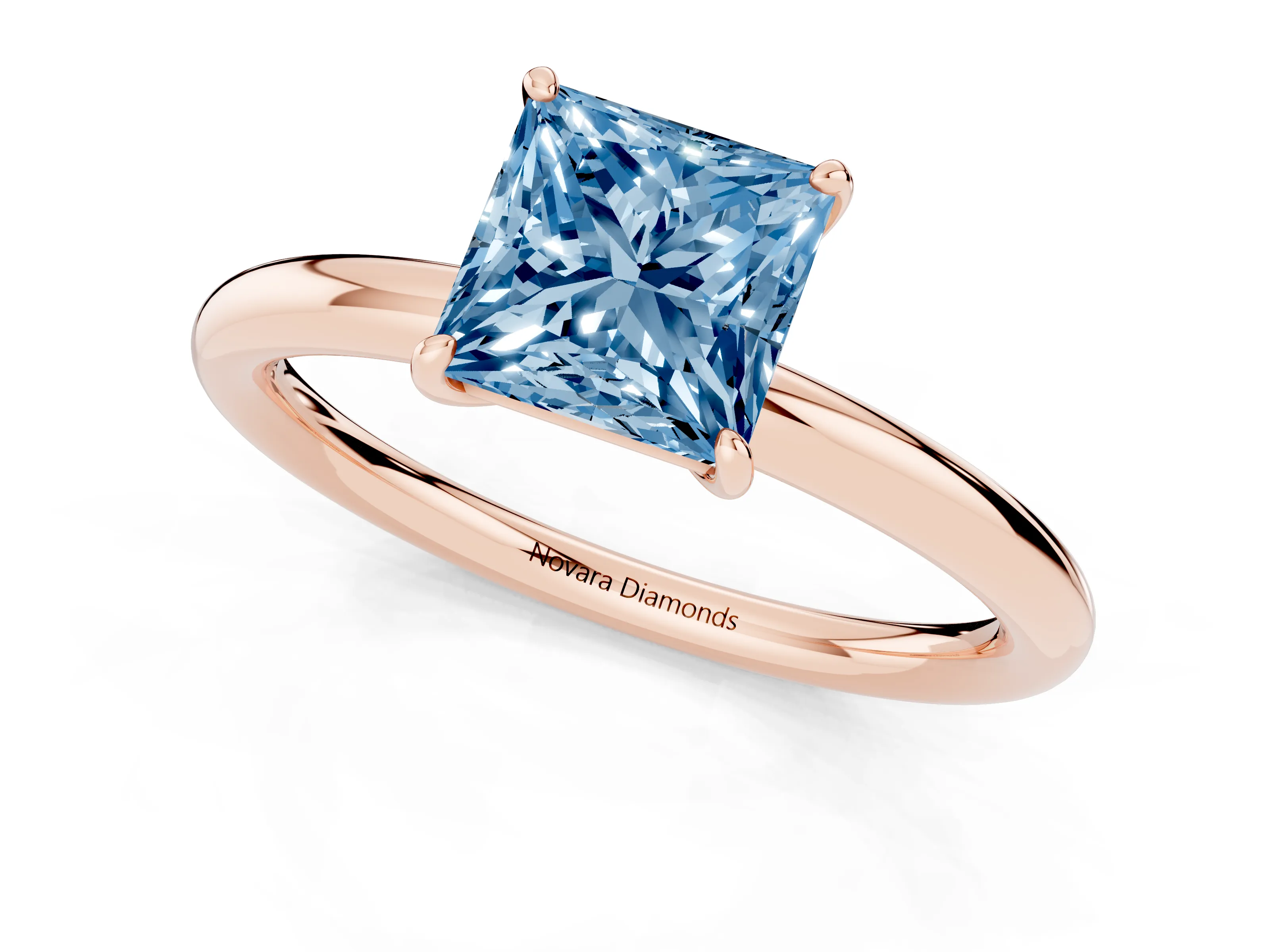 Fancy Blue Princess Cut Diamond Solitaire Ring Set in Rose gold with Prong Setting on a Polished Plain Band