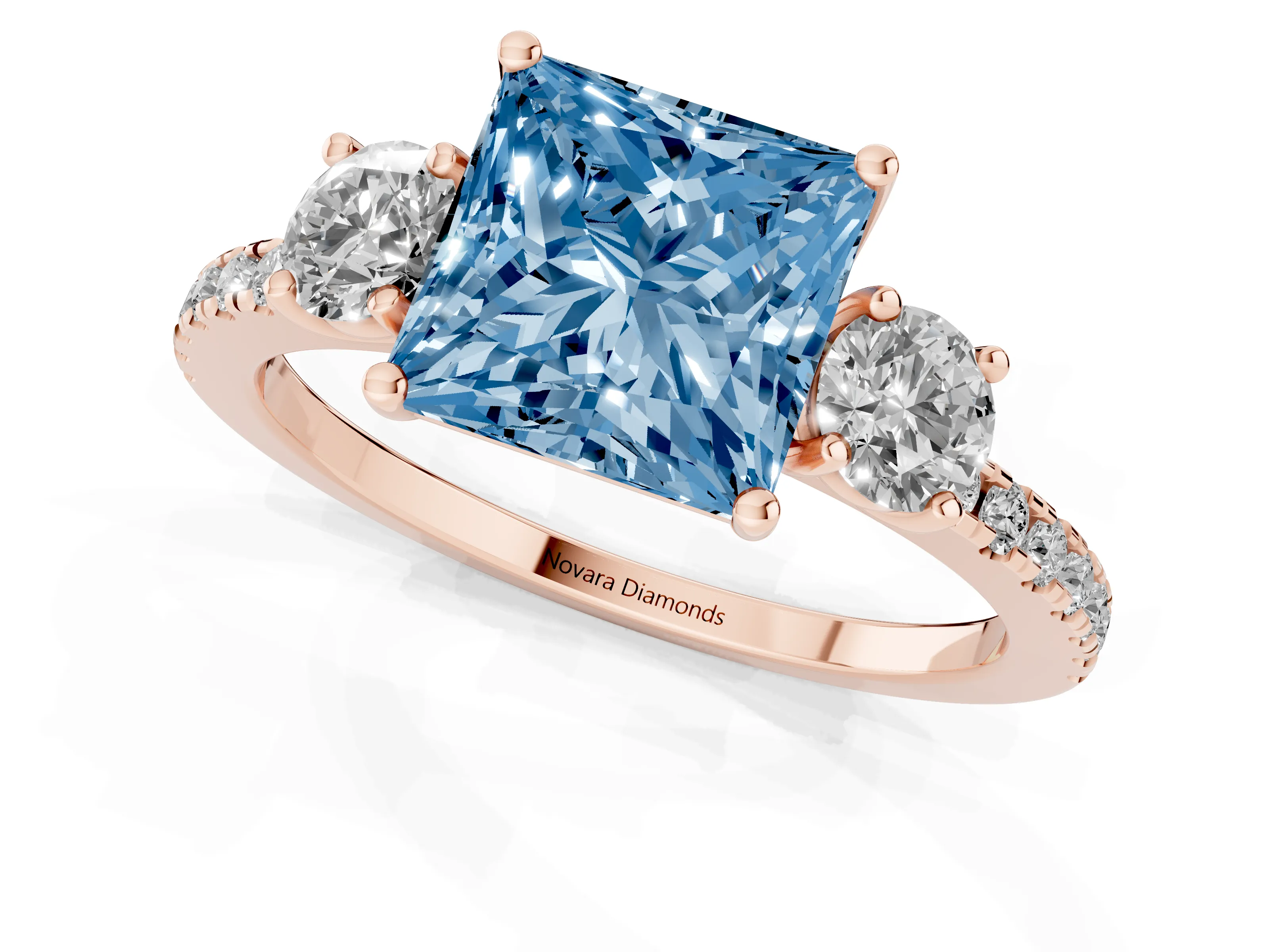 Fancy Blue Princess Cut Diamond Three-Stone Ring Set in Rose gold with Pavé Band and Graduated Sides