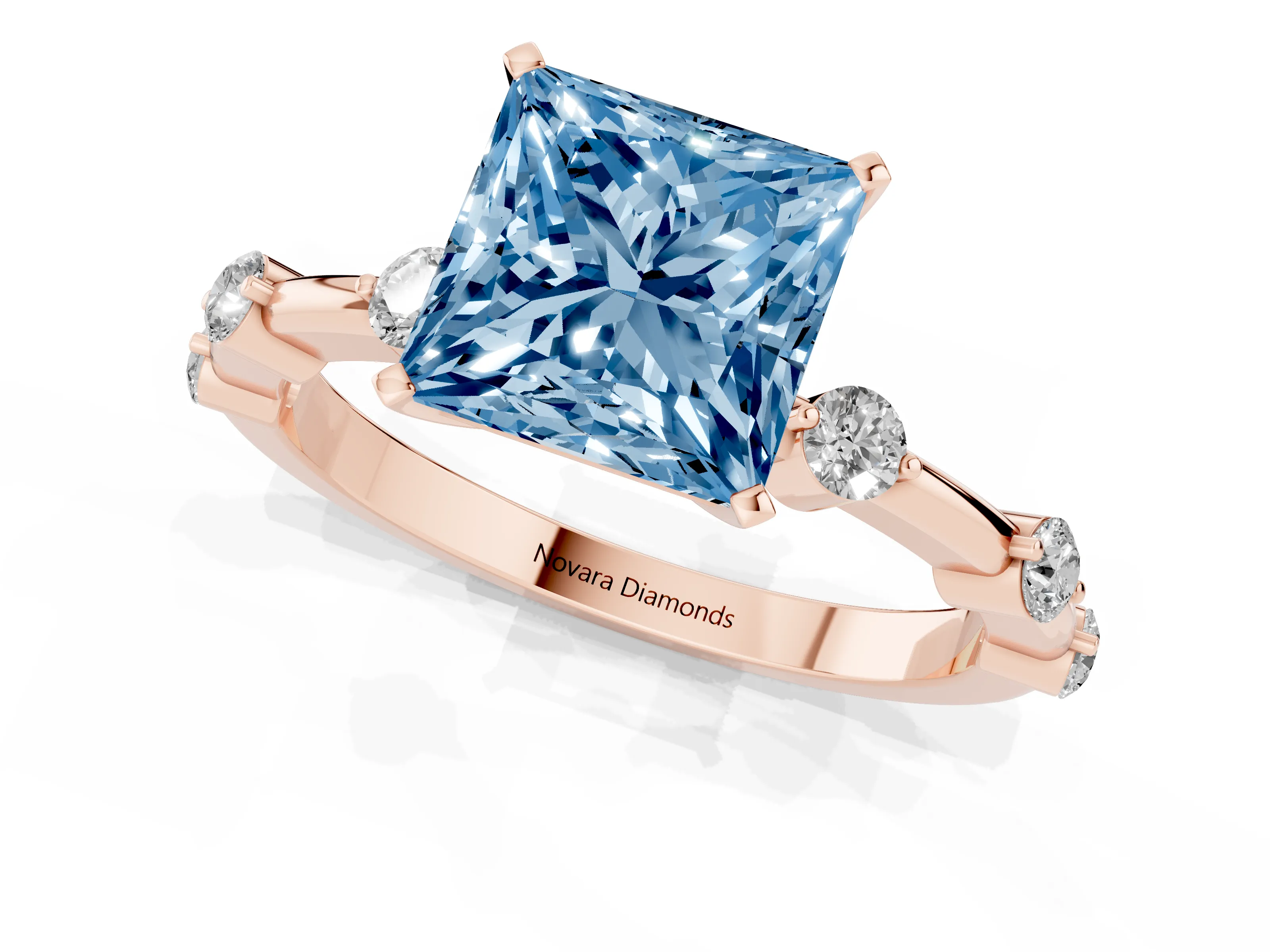 Fancy Blue Princess Cut Diamond Solitaire Ring Set in Rose gold with Bezel Set Side Stones and Prong Setting