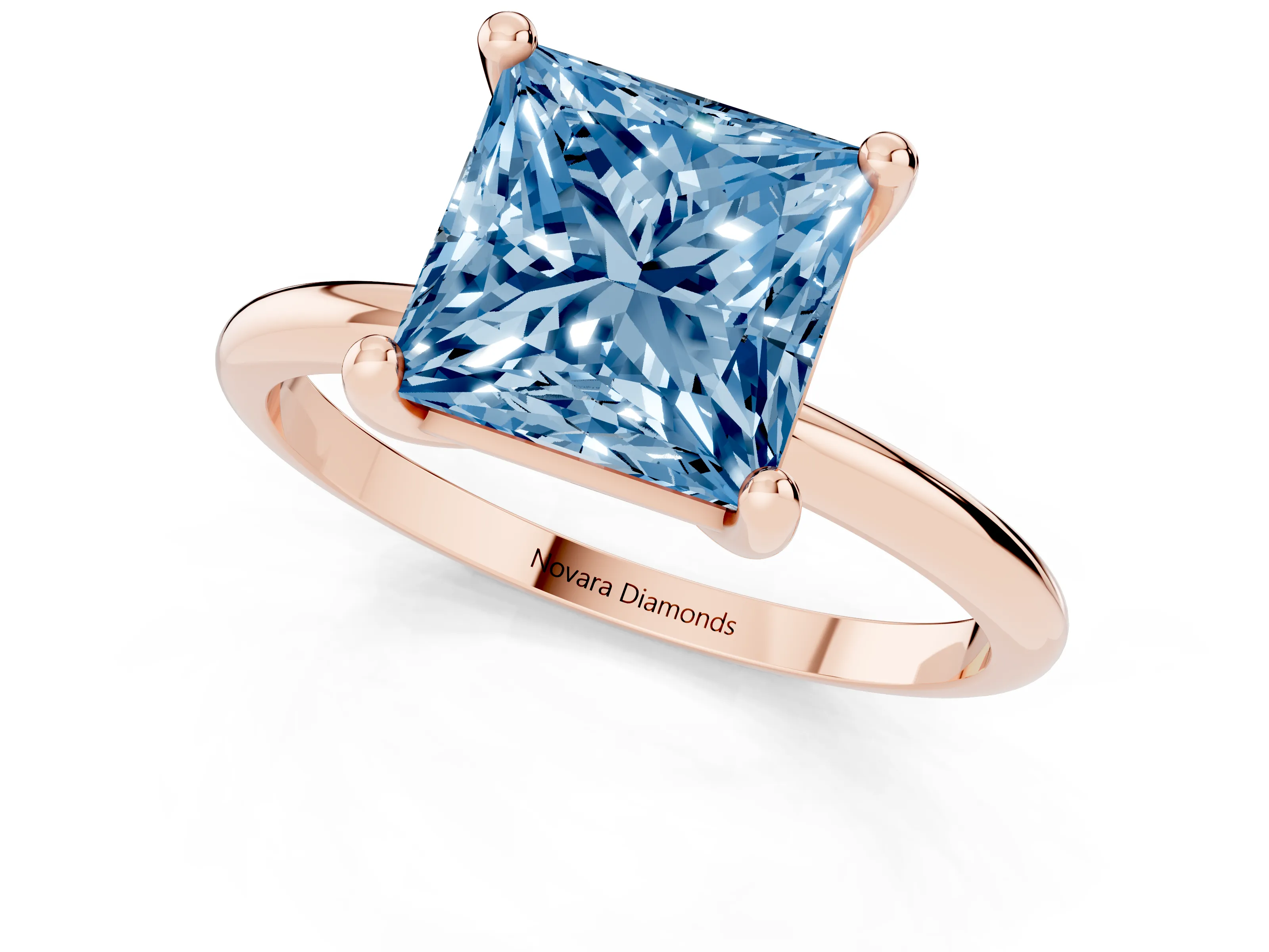 Fancy Blue Princess Cut Diamond Solitaire Ring Set in Rose gold with Secure Prong Setting on a Classic Band