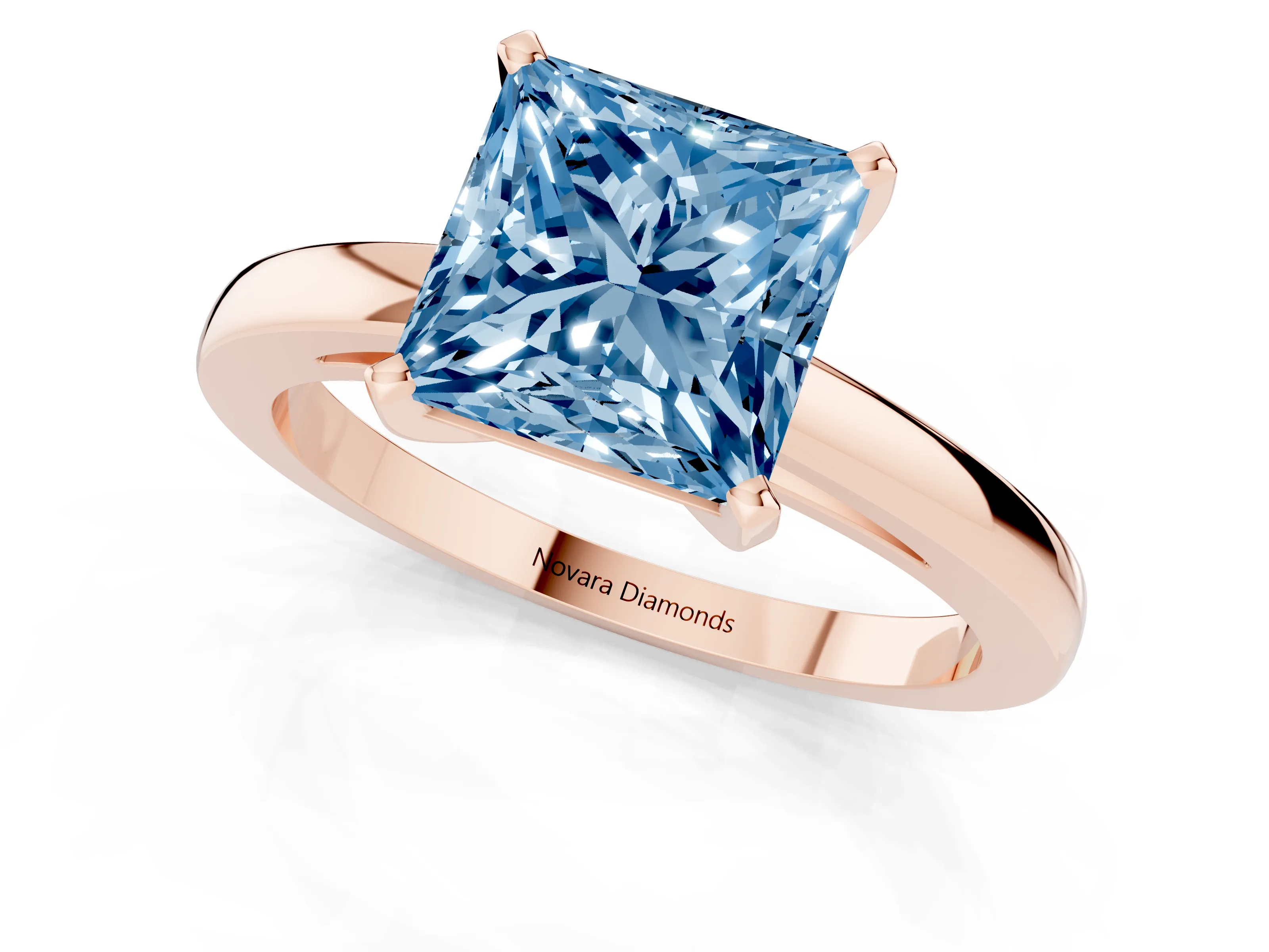 Fancy Blue Princess Cut Diamond Solitaire Engagement Ring Set in Rose gold with Prong Setting on a Classic Band