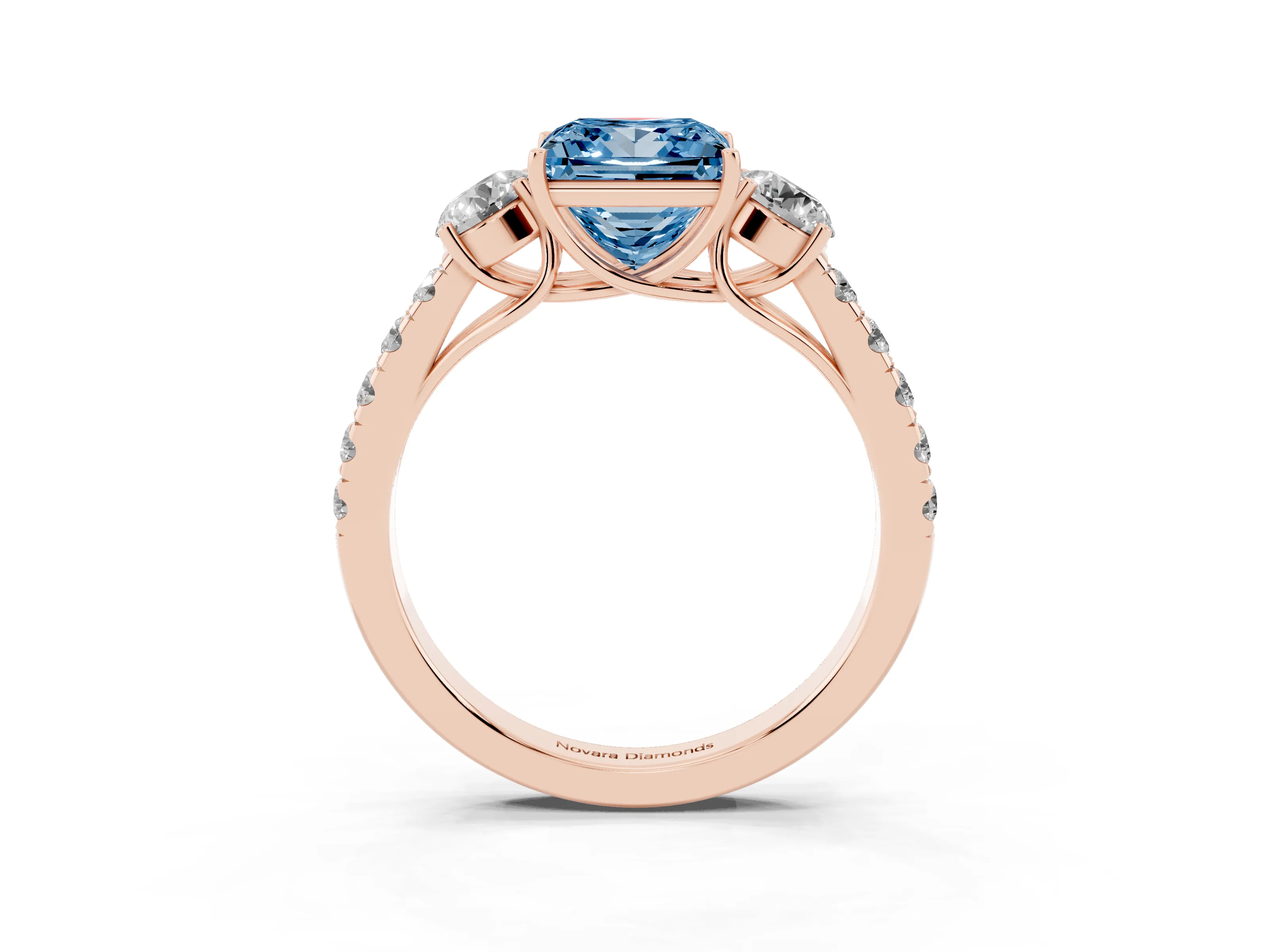 Fancy Blue Princess Cut Diamond Three-Stone Ring Set in Rose gold with Round Side Stones and Delicate Pavé Band