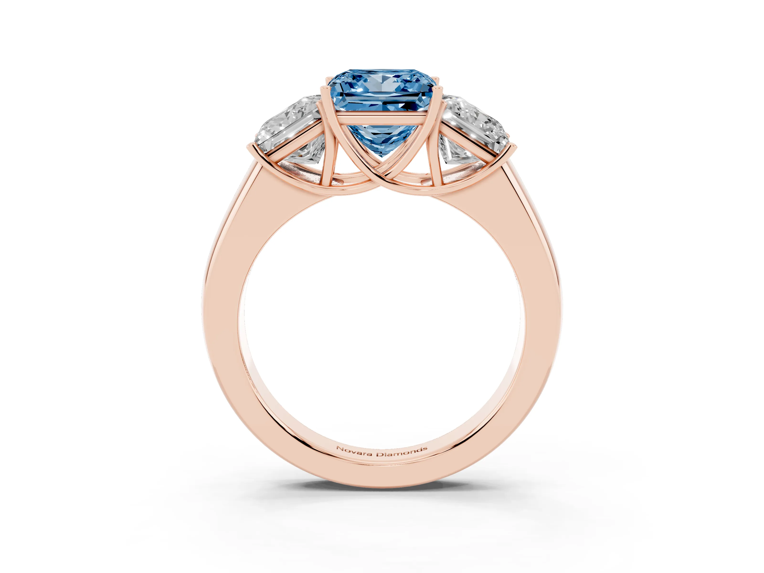 Fancy Blue Three-Stone Princess Cut Diamond Ring Set in Rose gold with Matching Prong Settings and Plain Band