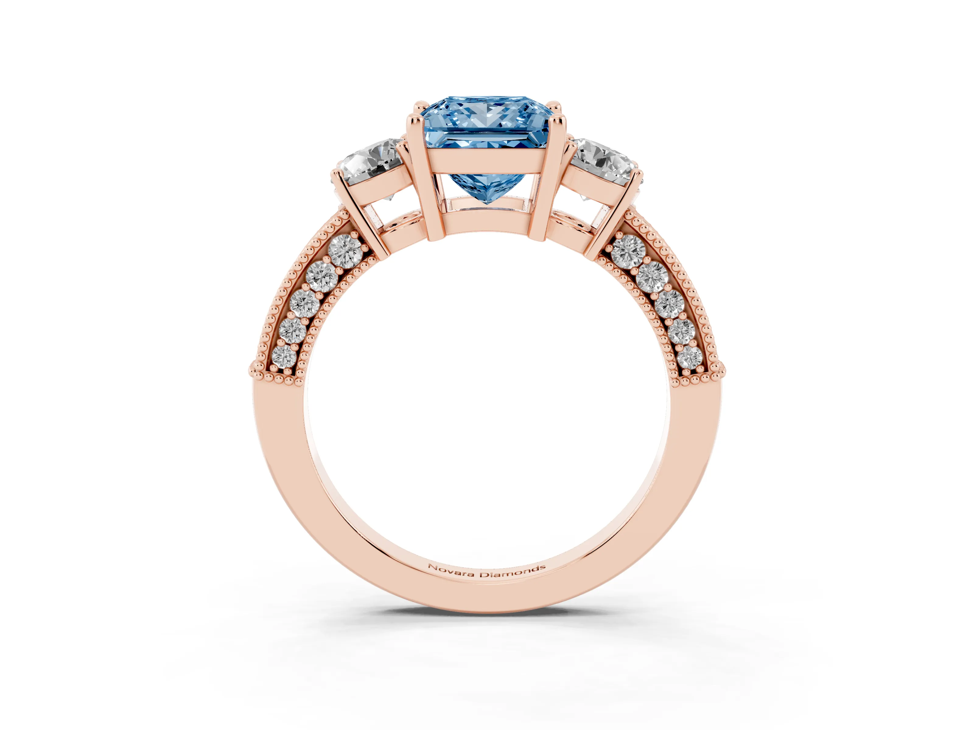 Fancy Blue Princess Cut Diamond Three-Stone Ring Set in Rose gold with Round Side Stones and Pavé Band