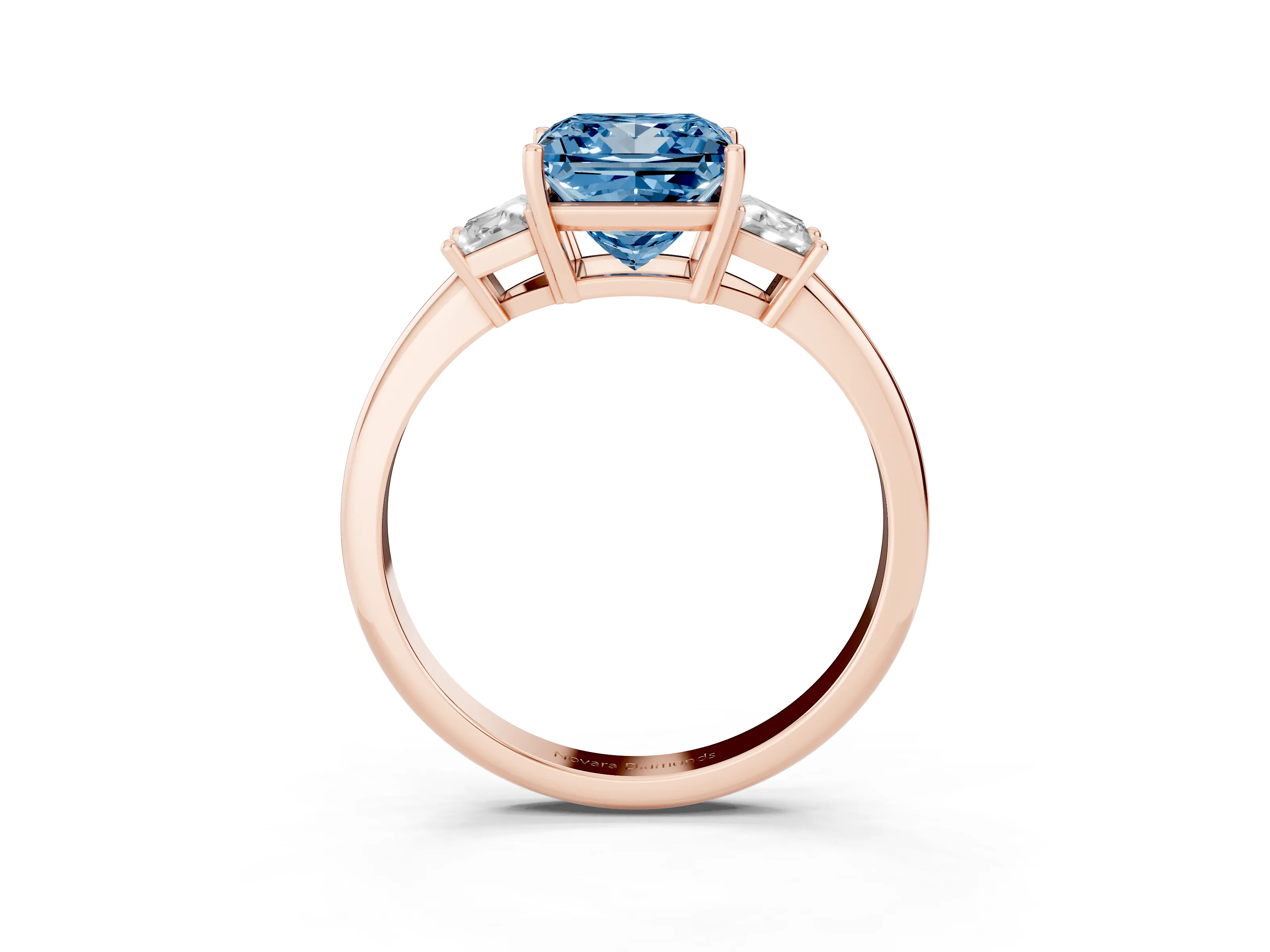 Fancy Blue Princess Cut Diamond Three-Stone Ring Set in Rose gold with Trapezoid Side Stones and Prong Setting