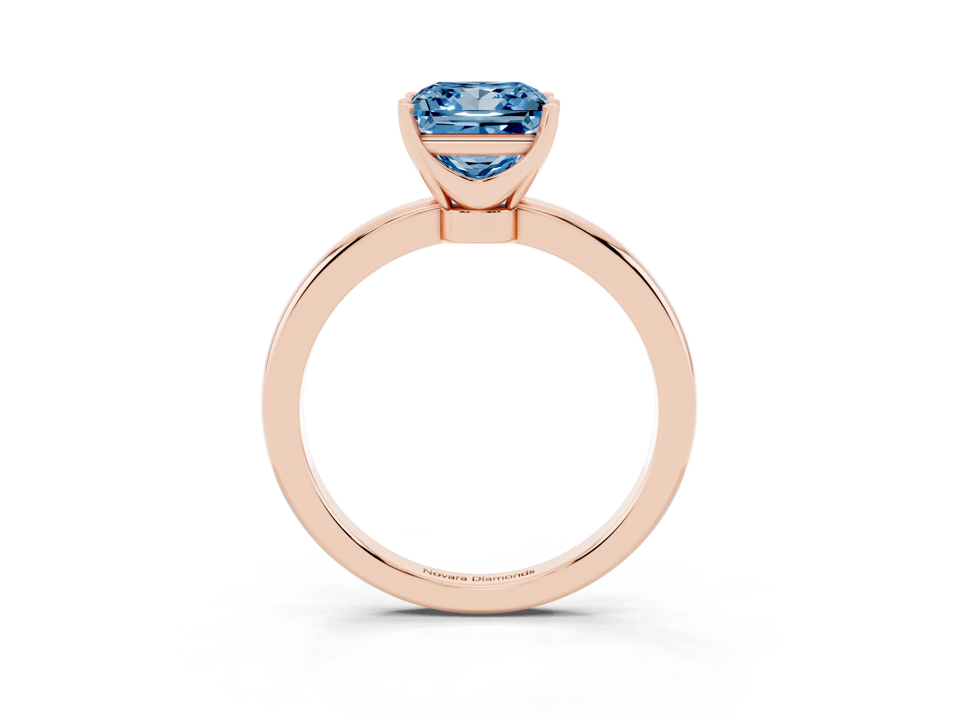 Fancy Blue Princess Cut Diamond Solitaire Ring Set in Rose gold with Raised Prong Setting on a Classic Band