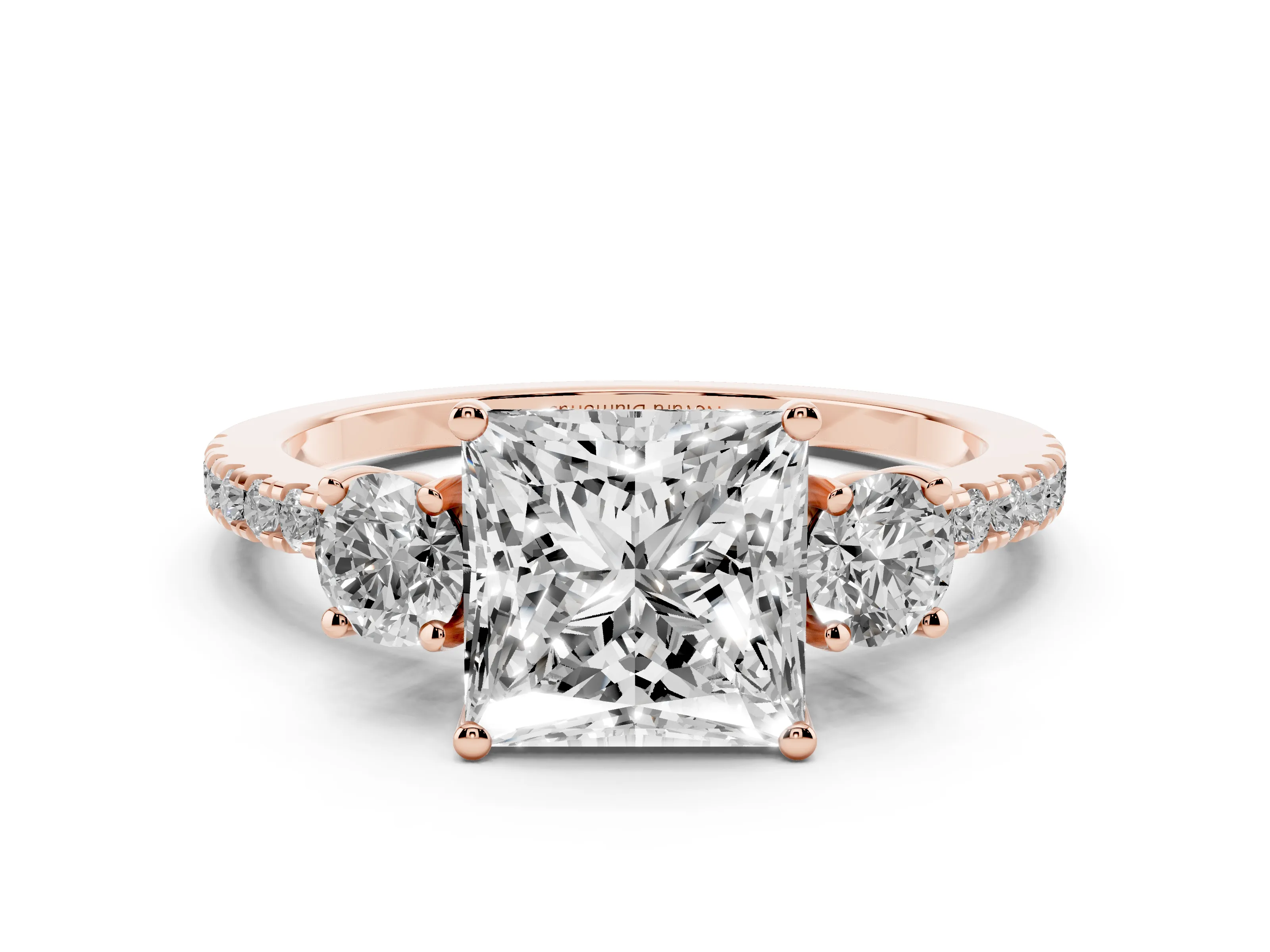 Princess Cut Diamond Three-Stone Ring Set in Rose gold with Pavé Band and Graduated Sides