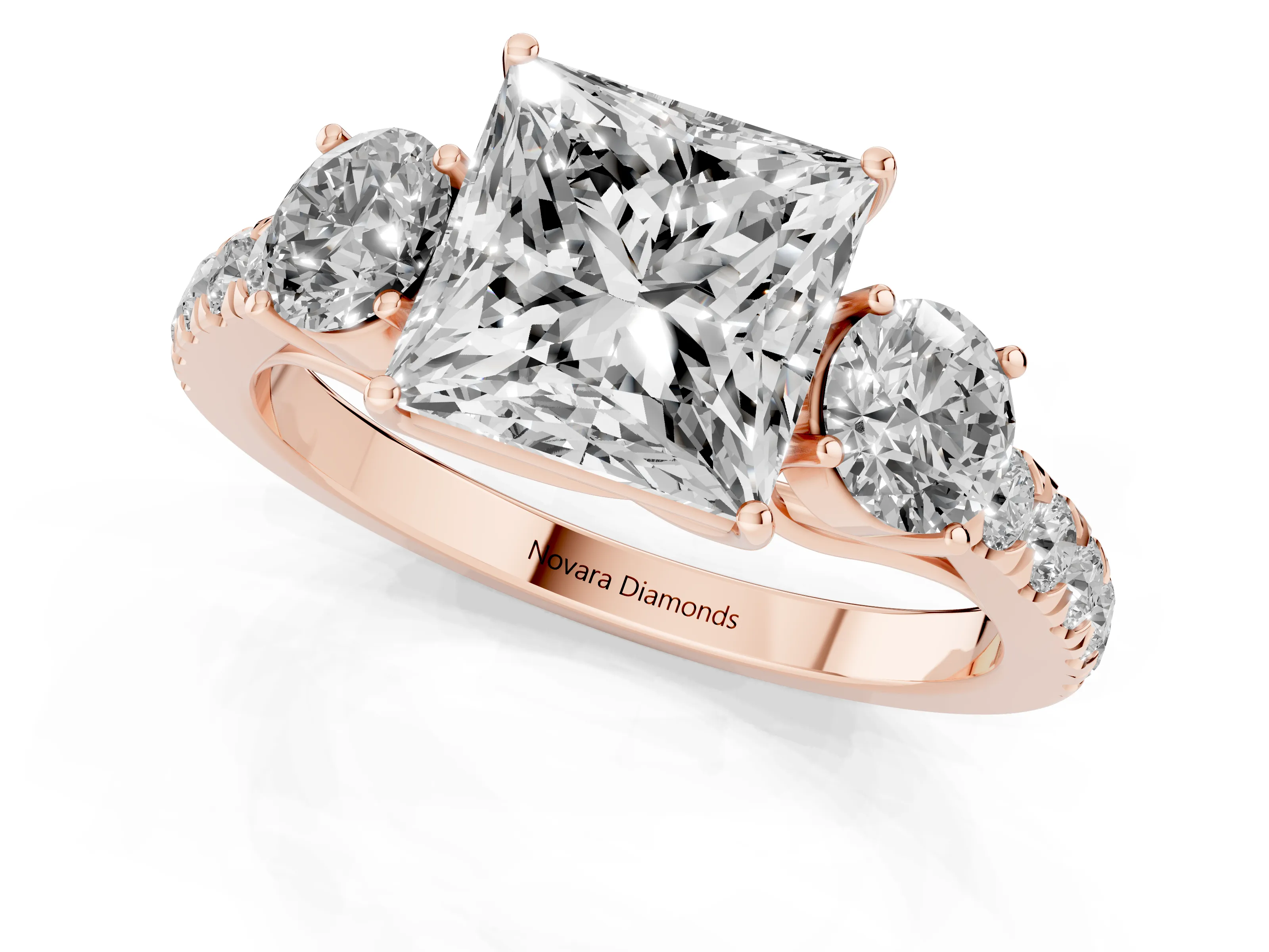 Princess Cut Diamond Three-Stone Ring Set in Rose gold with Round Side Stones and Delicate Pavé Band