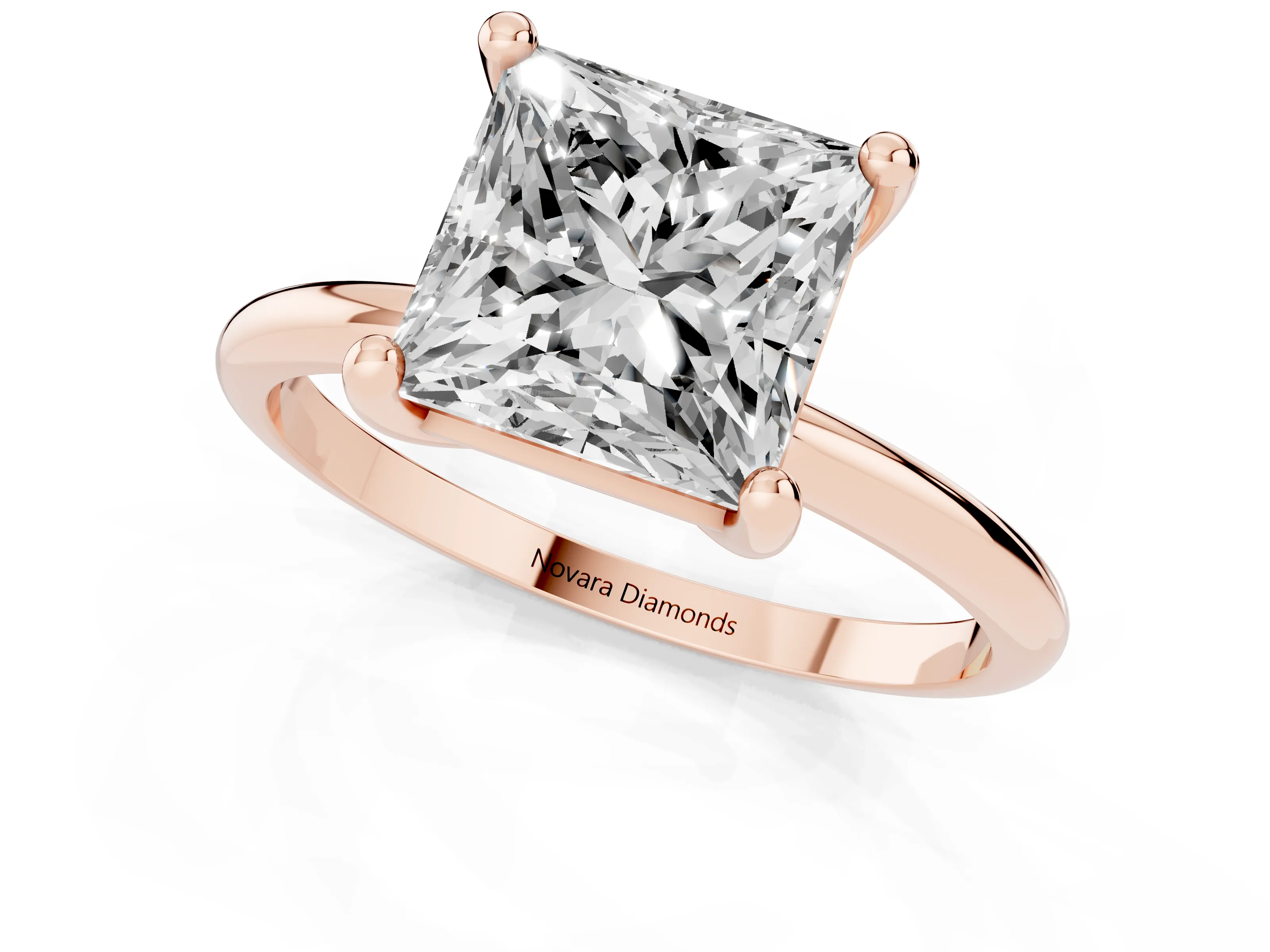 Princess Cut Diamond Solitaire Ring Set in Rose gold with Secure Prong Setting on a Classic Band