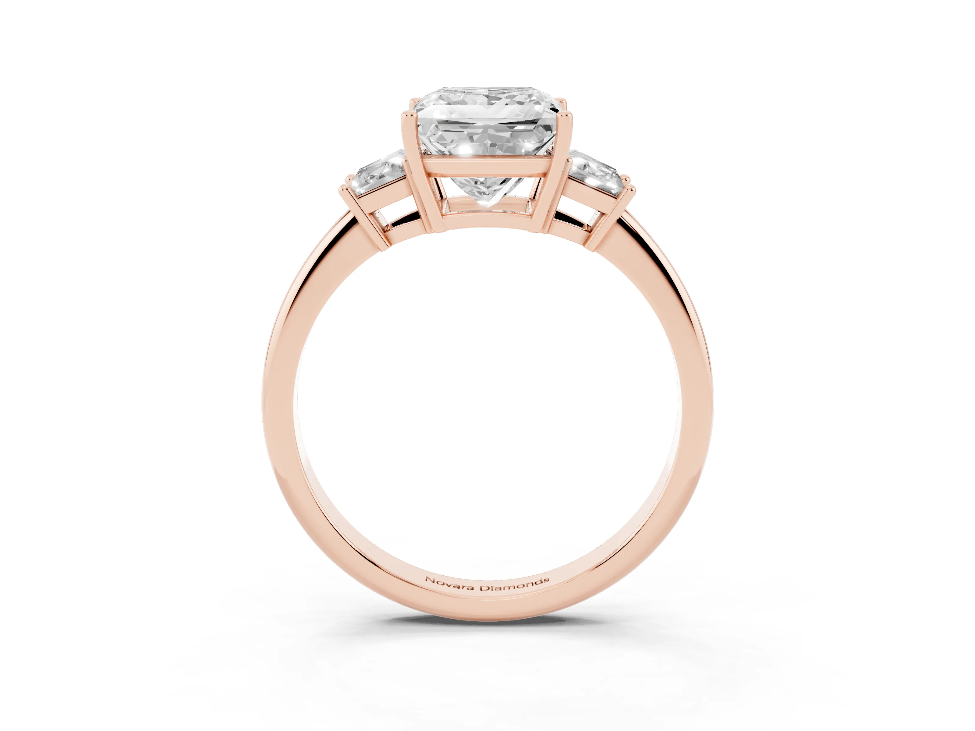 Princess Cut Diamond Three-Stone Ring Set in Rose gold with Trapezoid Side Stones and Prong Setting