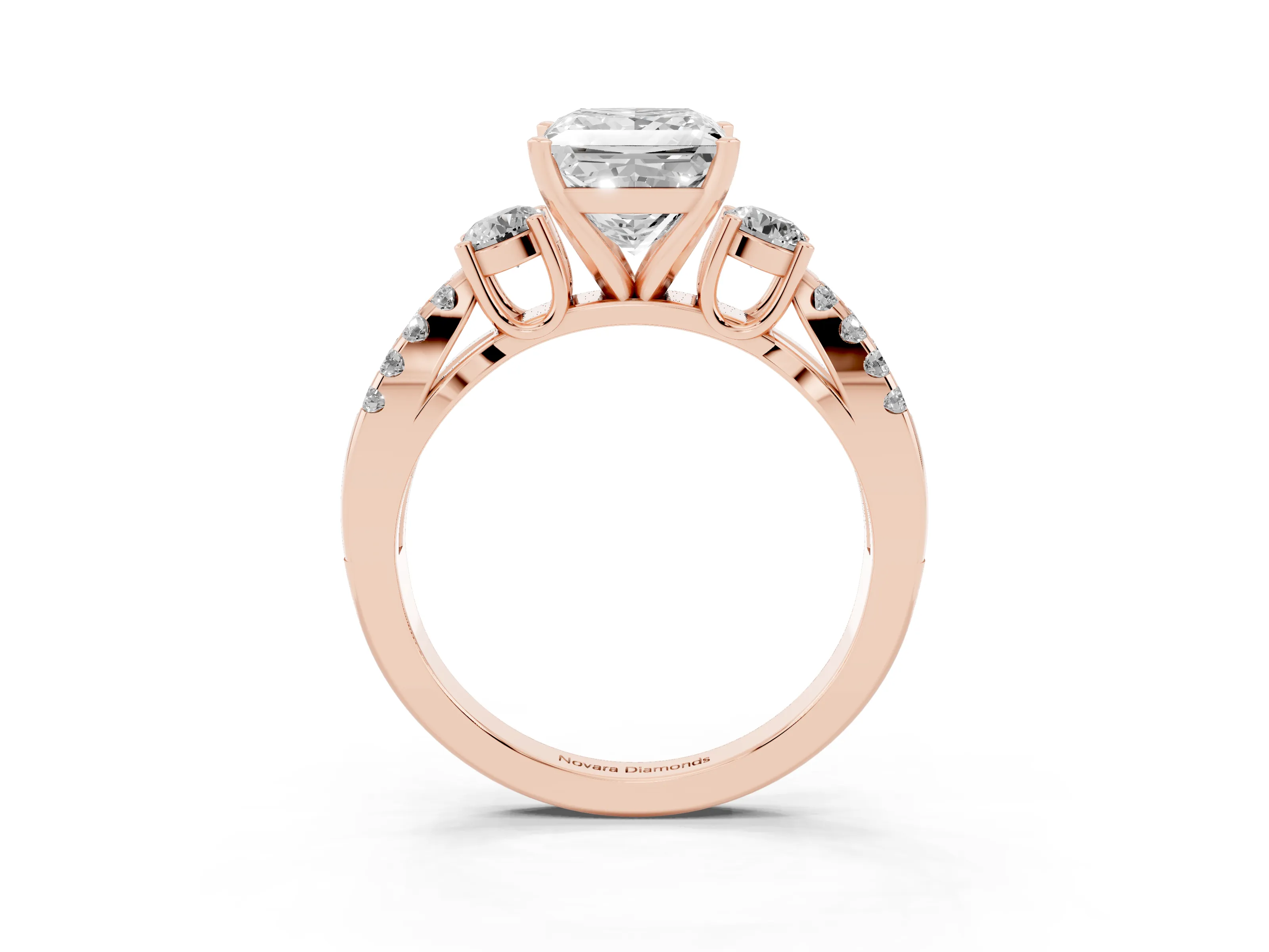 Princess Cut Diamond Three-Stone Ring Set in Rose gold with Pavé Split Shank and Prong Setting
