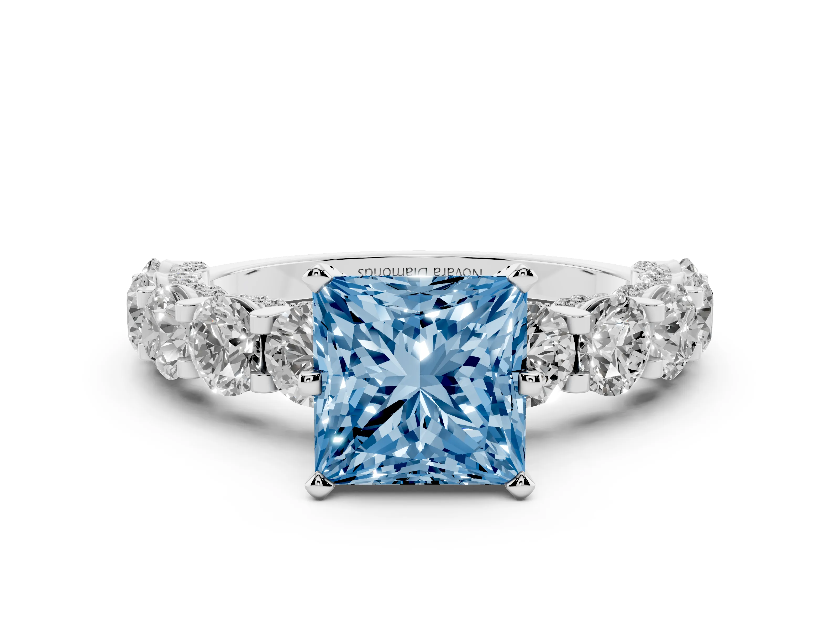 Fancy Blue Princess Cut Diamond Side Stone Ring Set in White gold with Alternating Round and Oval Side Stones