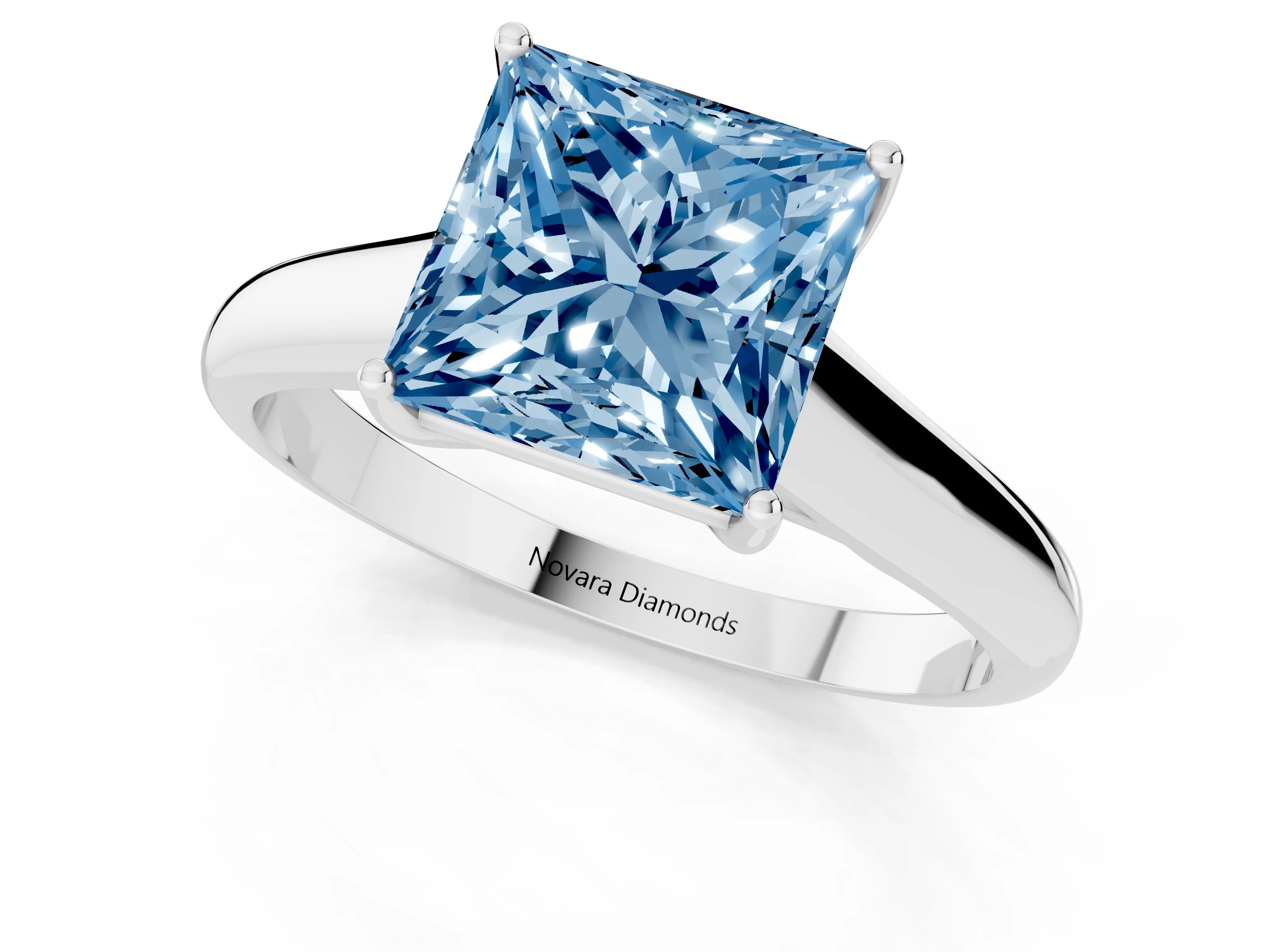 Fancy Blue Princess Cut Diamond Solitaire Engagement Ring Set in White gold with Subtly Tapered Band and Prong Setting