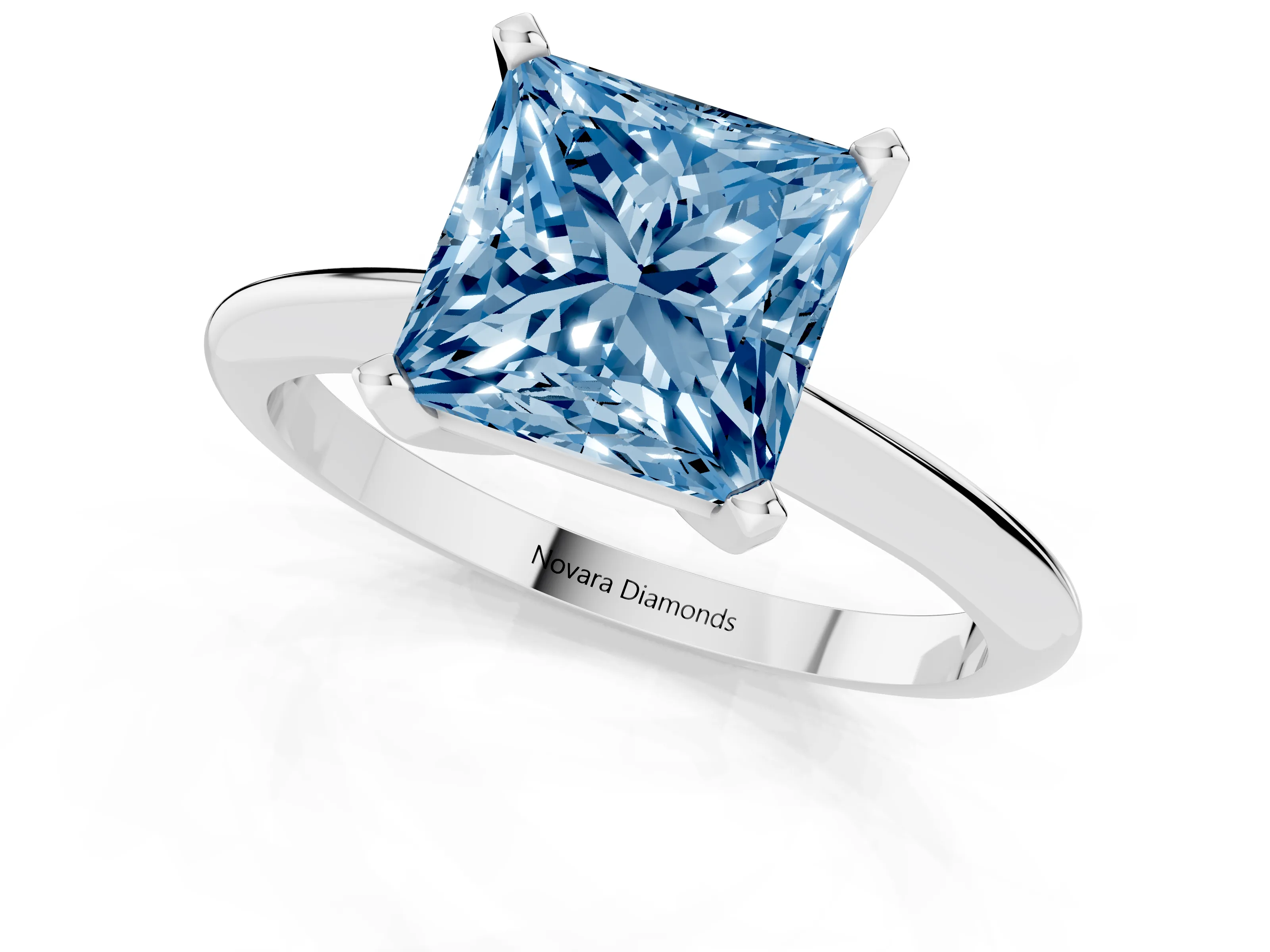 Fancy Blue Princess Cut Diamond Solitaire Ring Set in Platinum with Prong Setting on a Plain Round Band