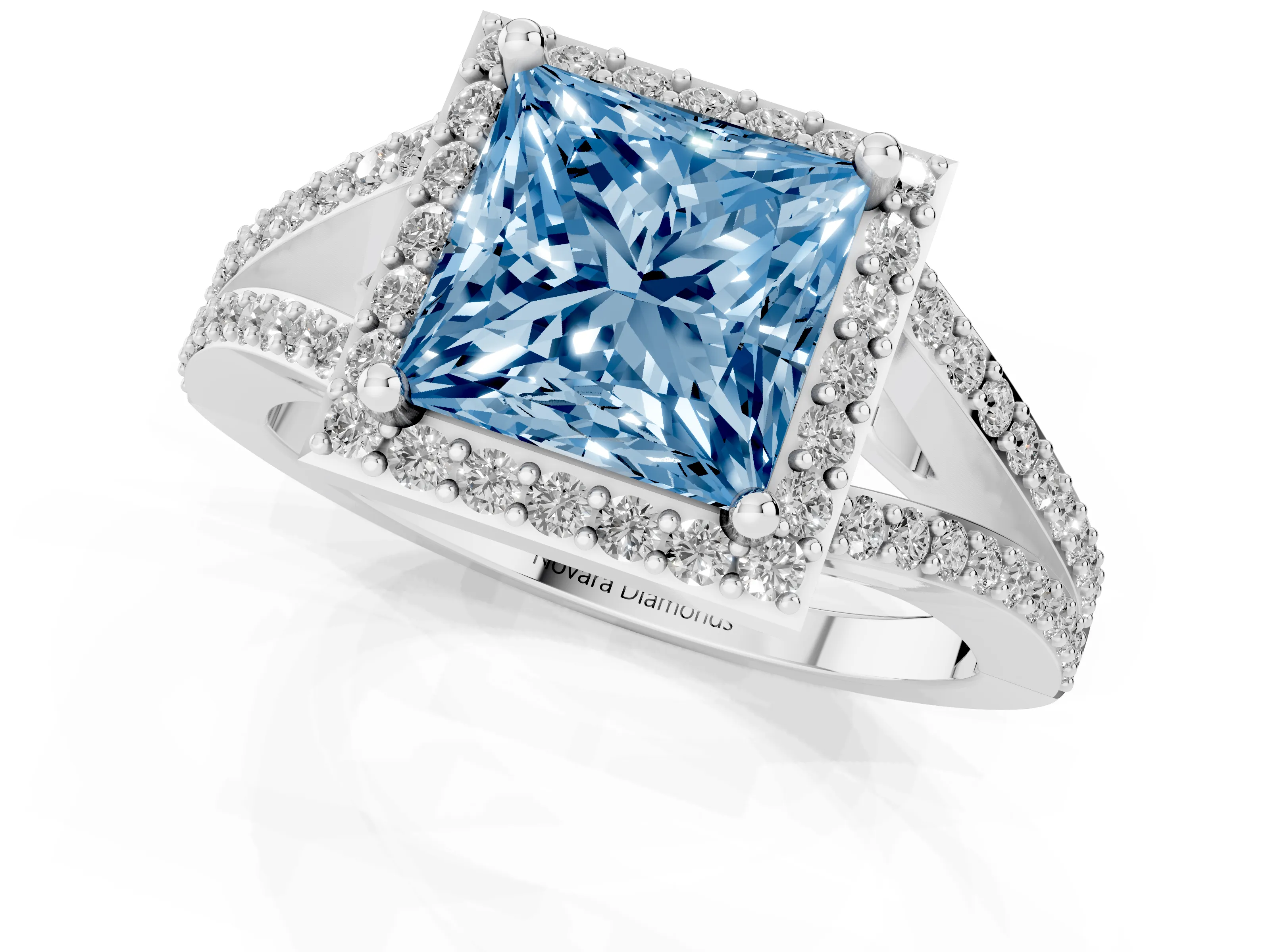 Fancy Blue Princess Cut Diamond Halo Split Shank Pavé Ring Set in White gold with Prong Setting