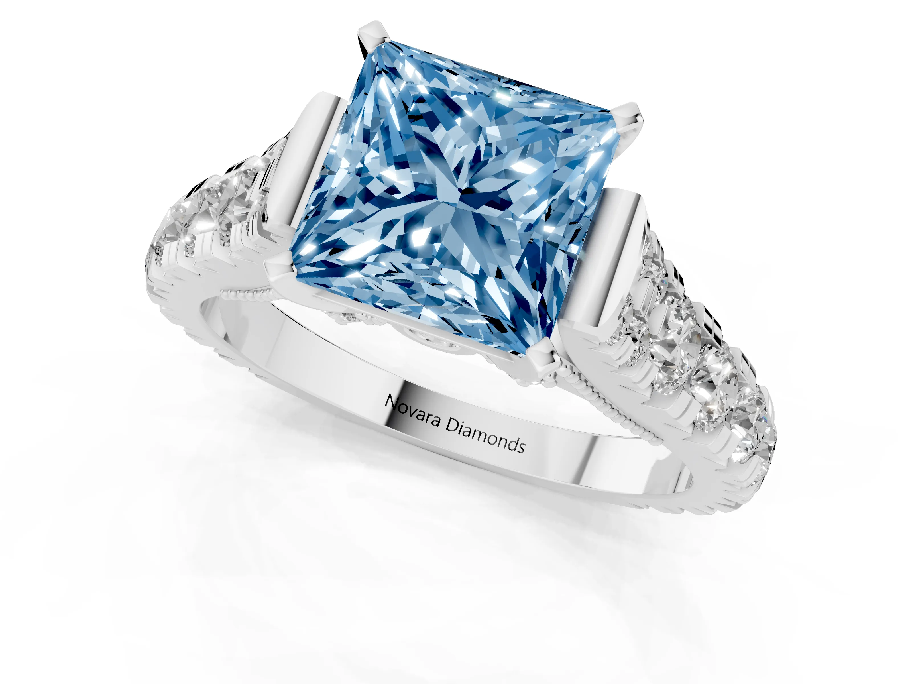 Fancy Blue Princess Cut Diamond Classic Solitaire Ring Set in White gold with Pavé Band and Prong Setting