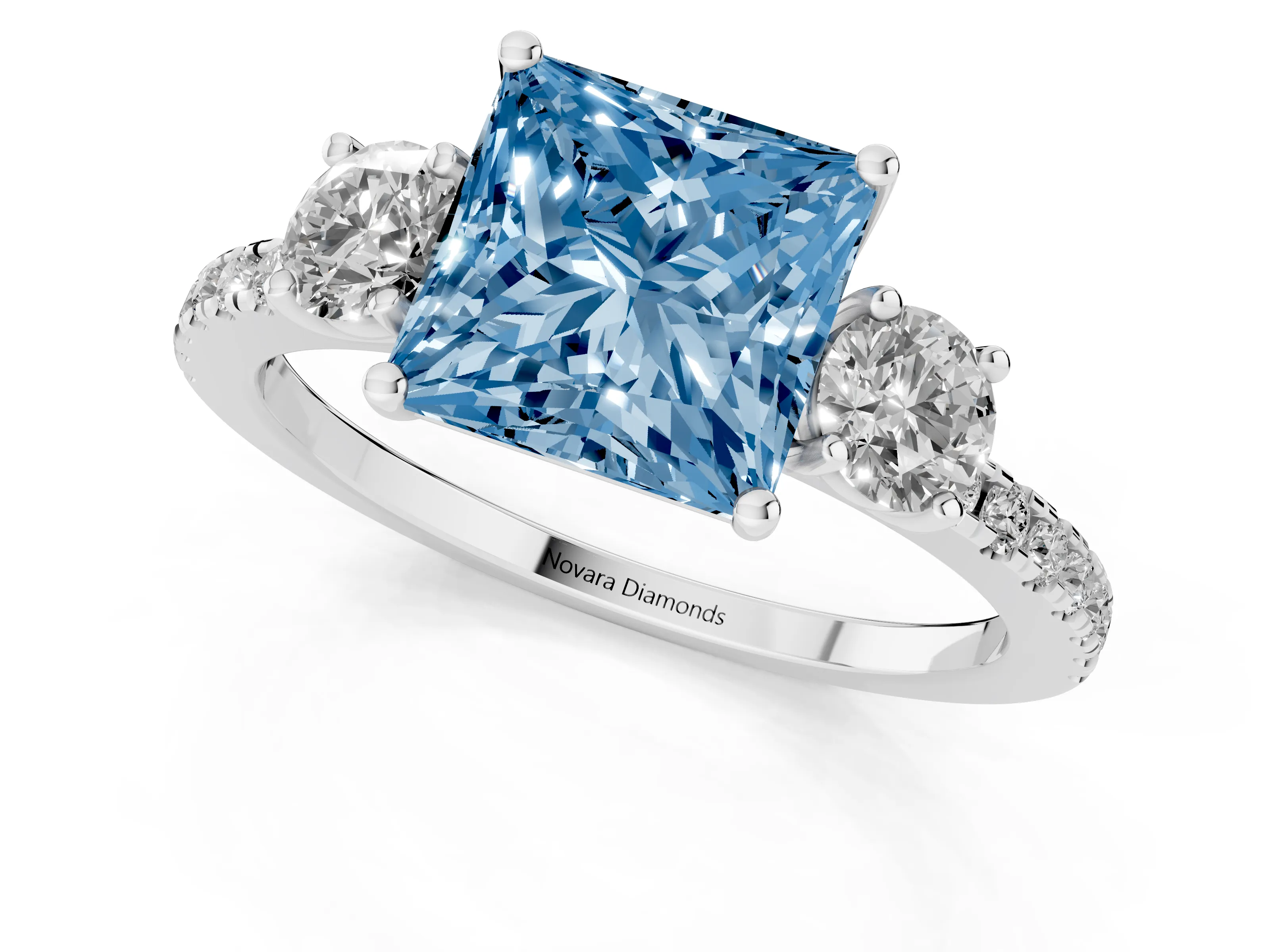 Fancy Blue Princess Cut Diamond Three-Stone Ring Set in White gold with Pavé Band and Graduated Sides – second view