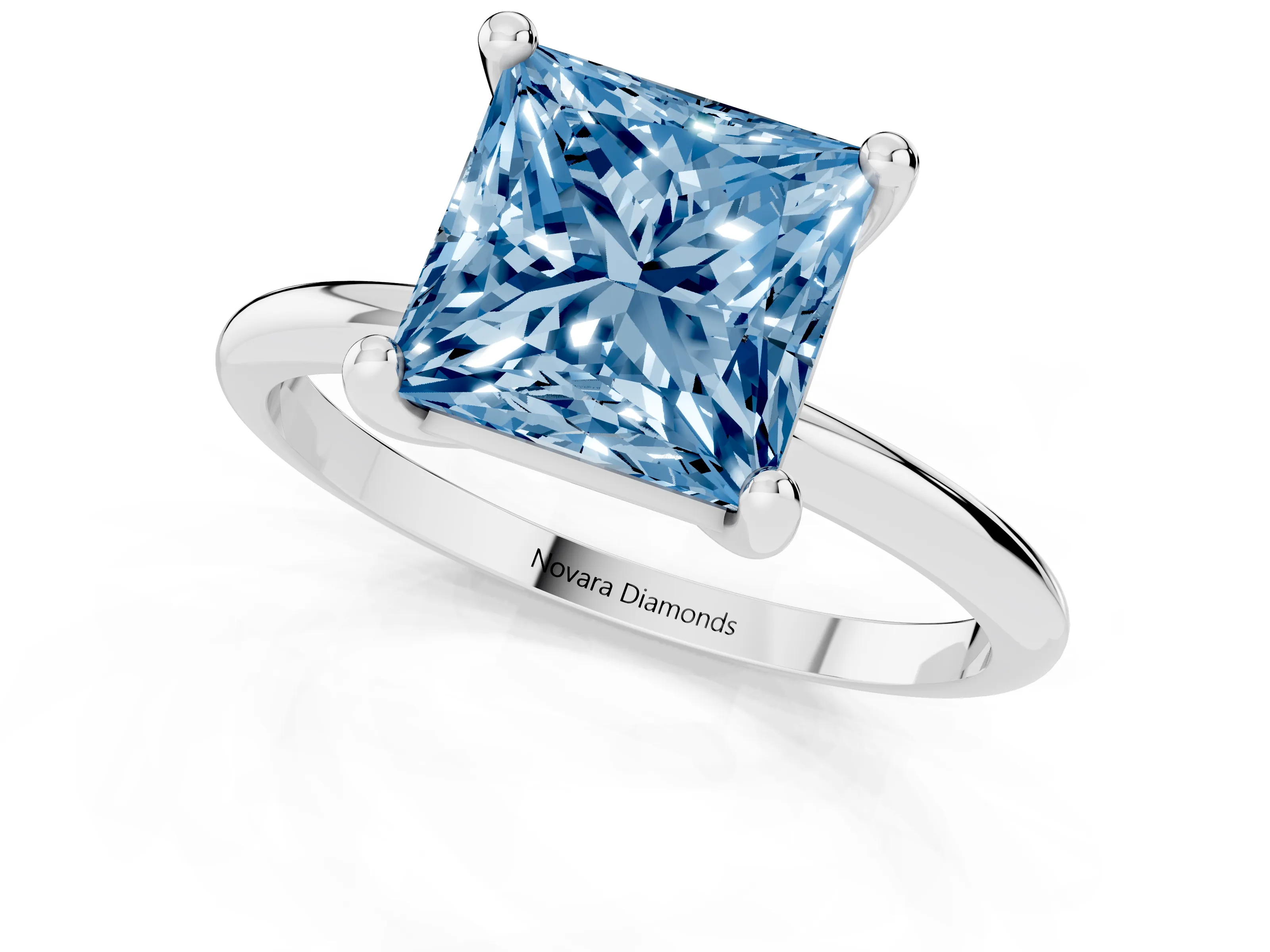 Fancy Blue Princess Cut Diamond Solitaire Ring Set in White gold with Secure Prong Setting on a Classic Band