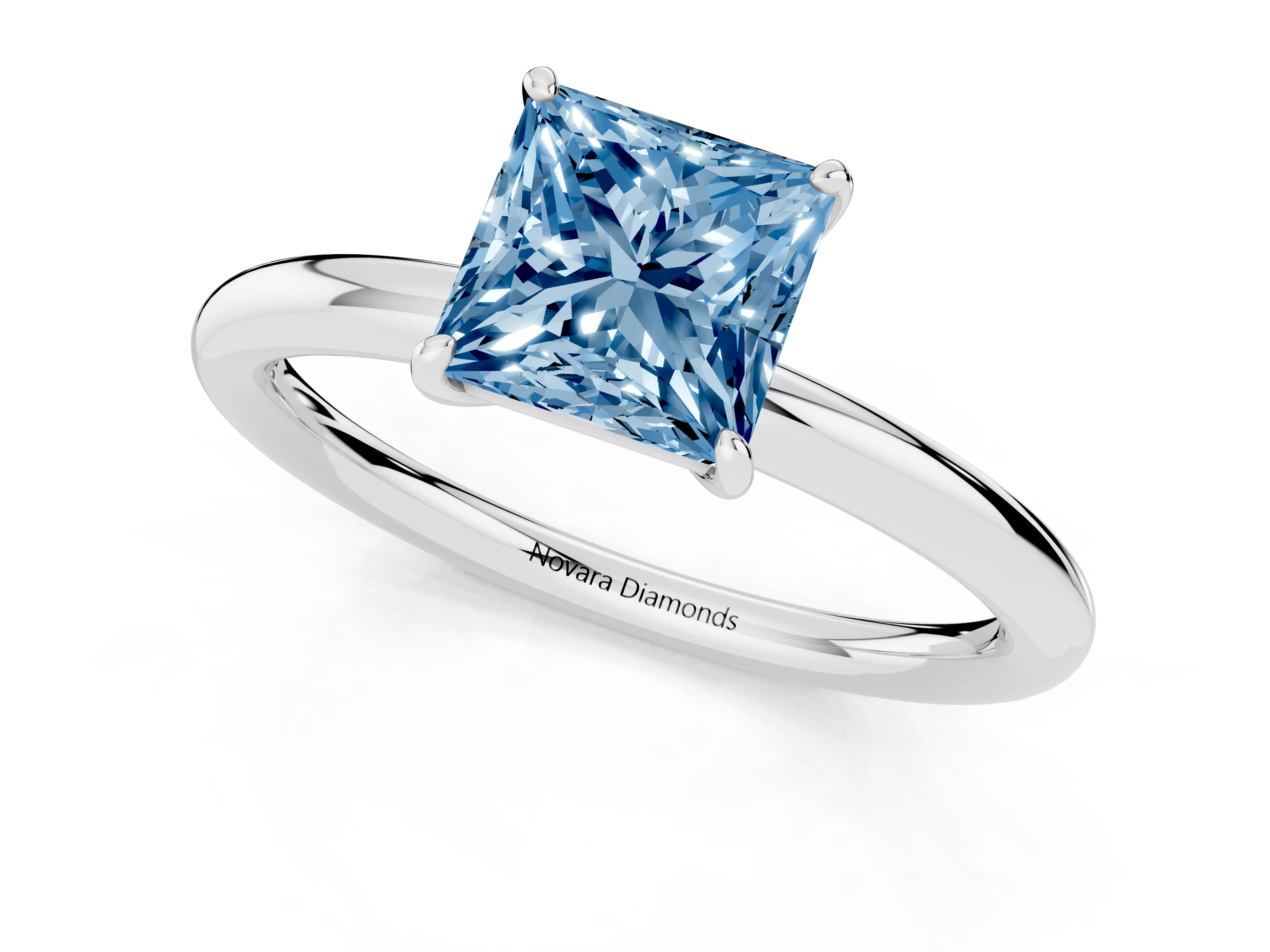 Fancy Blue Princess Cut Diamond Solitaire Ring Set in Silver with Prong Setting on a Polished Plain Band