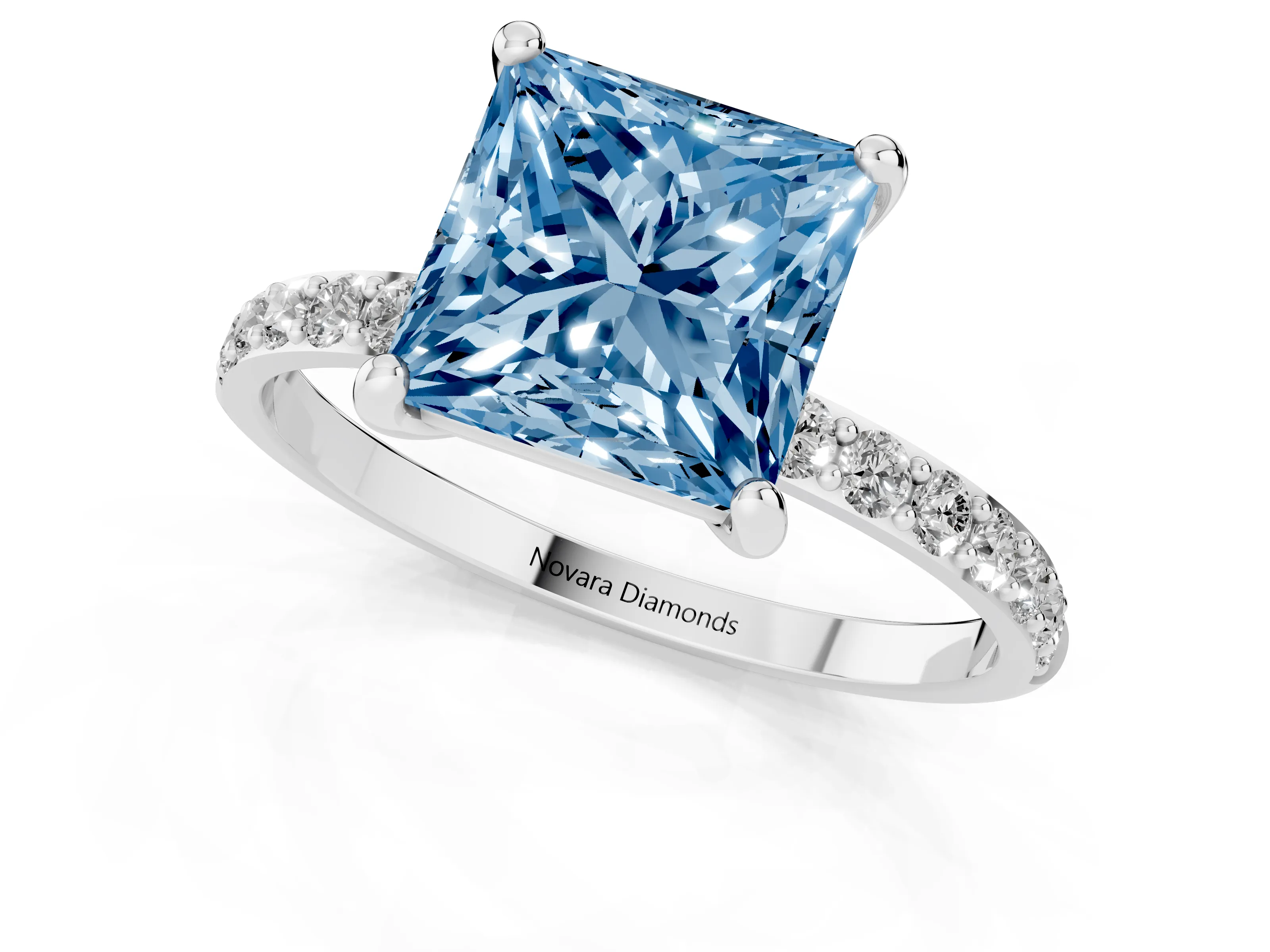 Fancy Blue Princess Cut Diamond Solitaire Ring Set in White gold with Round Pavé Band and Prong Setting