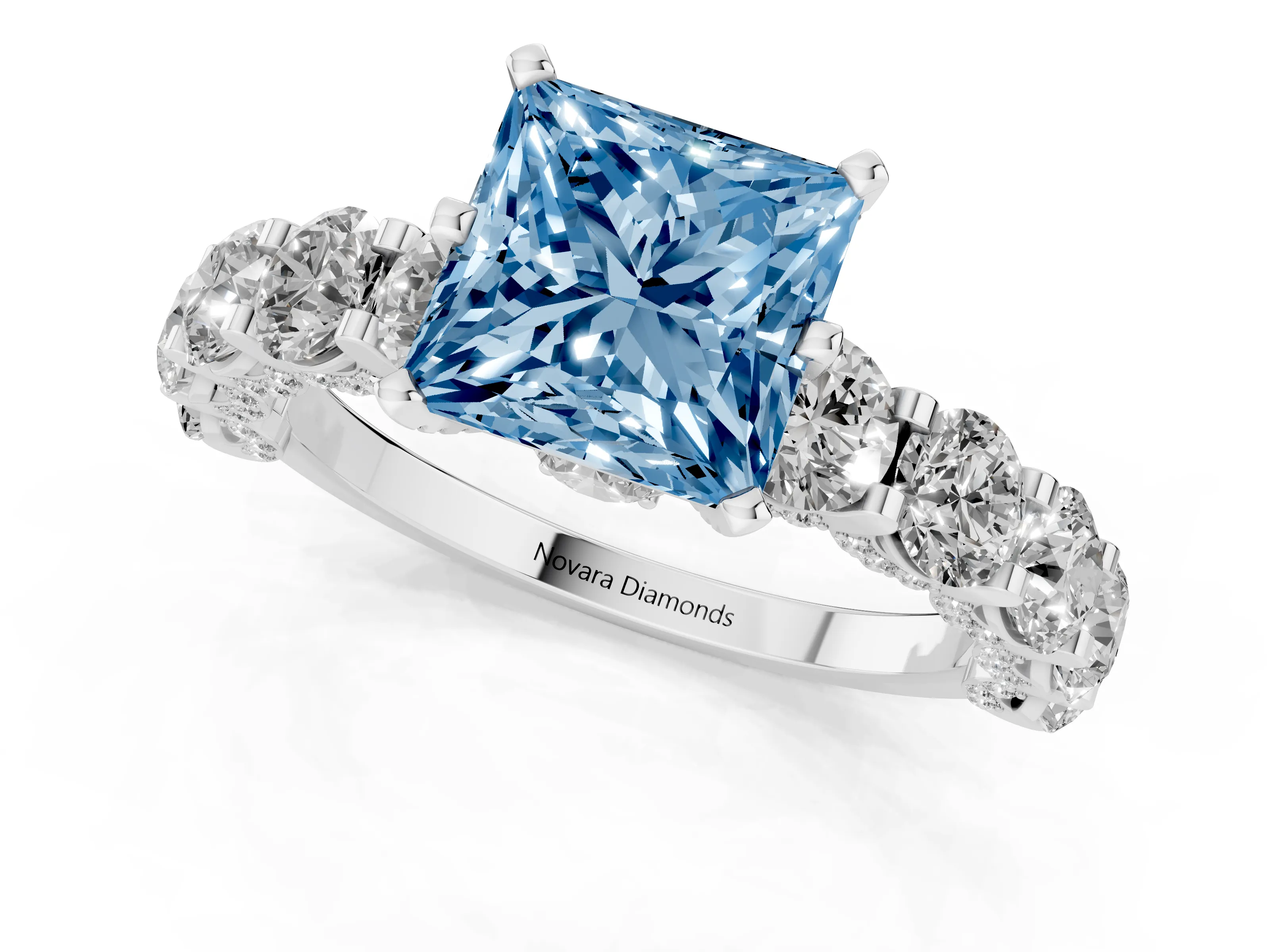Fancy Blue Princess Cut Diamond Side Stone Ring Set in Platinum with Alternating Round and Oval Side Stones