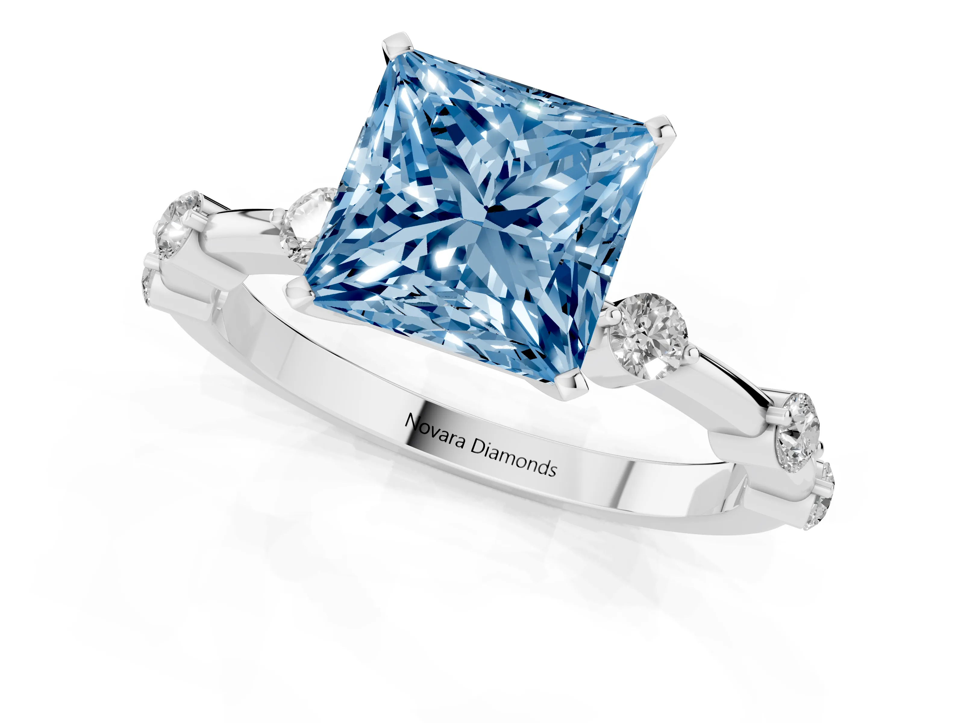 Fancy Blue Princess Cut Diamond Solitaire Ring Set in Silver with Bezel Set Side Stones and Prong Setting
