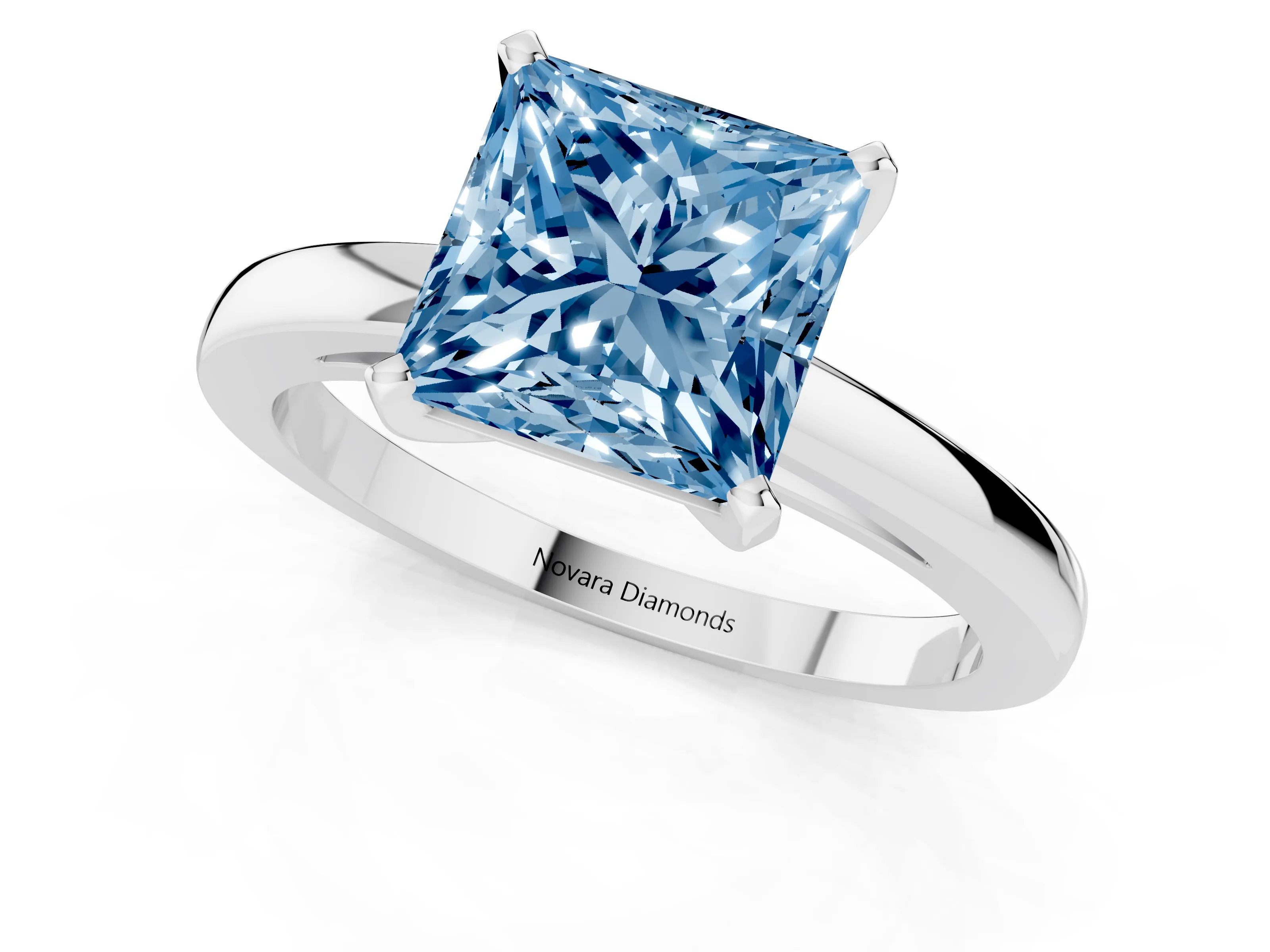 Fancy Blue Princess Cut Diamond Solitaire Engagement Ring Set in White gold with Prong Setting on a Classic Band