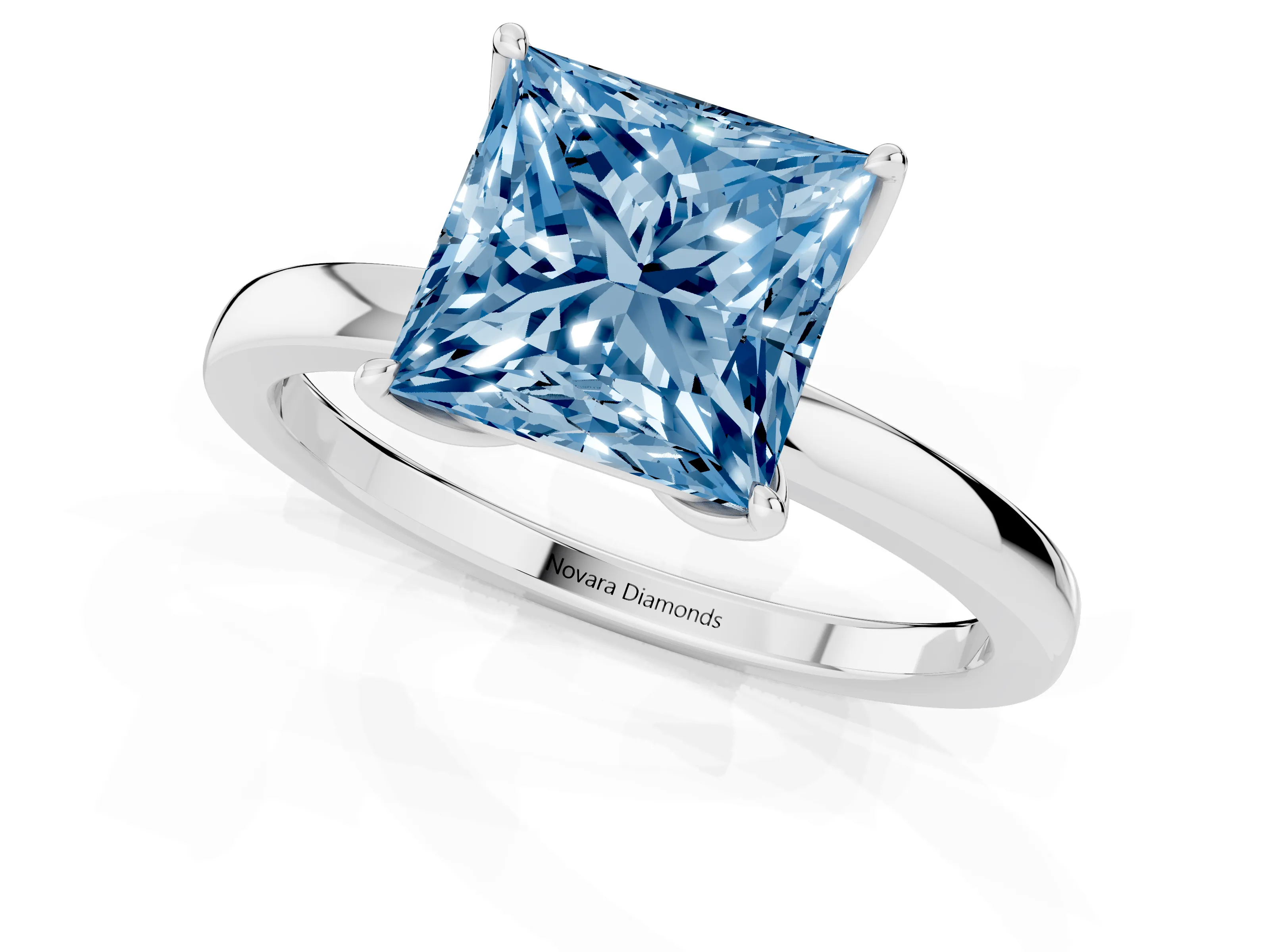 Fancy Blue Princess Cut Diamond Solitaire Ring Set in White gold with Prong Setting and Thin Polished Band