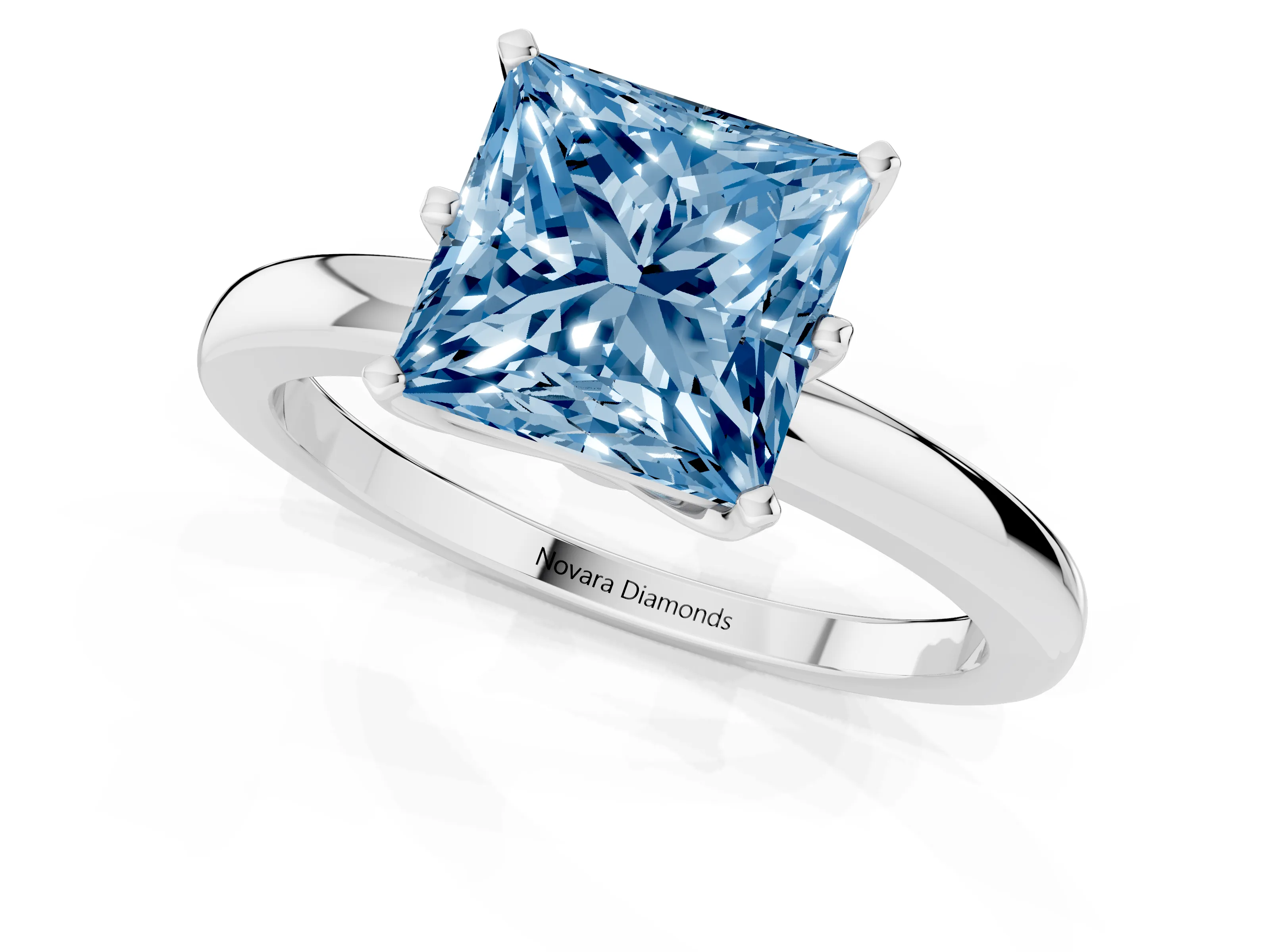 Fancy Blue Princess Cut Diamond Solitaire Ring Set in White gold with Raised Prong Setting on a Classic Band