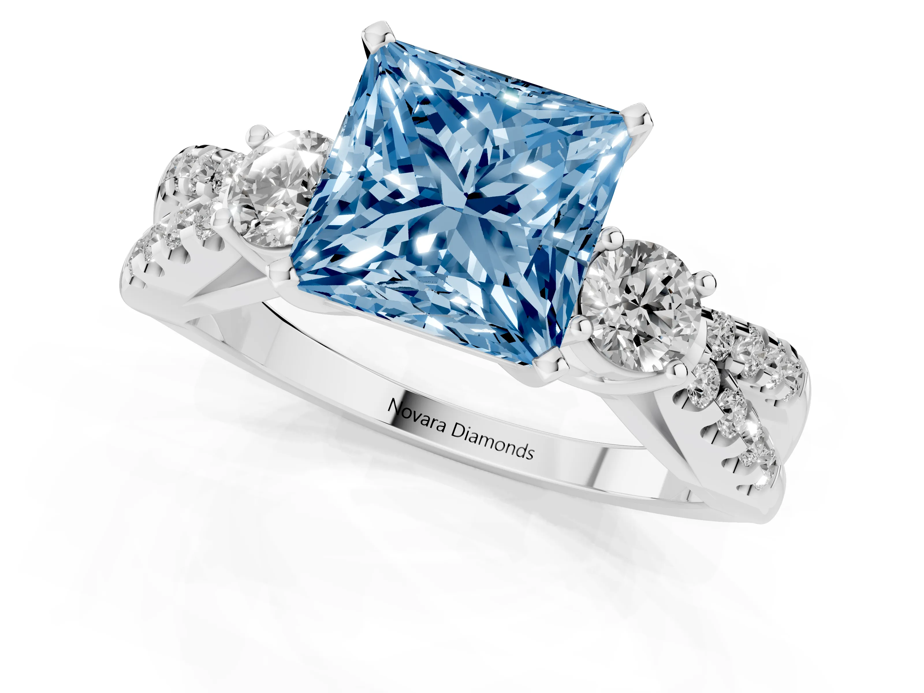 Fancy Blue Princess Cut Diamond Three-Stone Ring Set in Platinum with Pavé Split Shank and Prong Setting