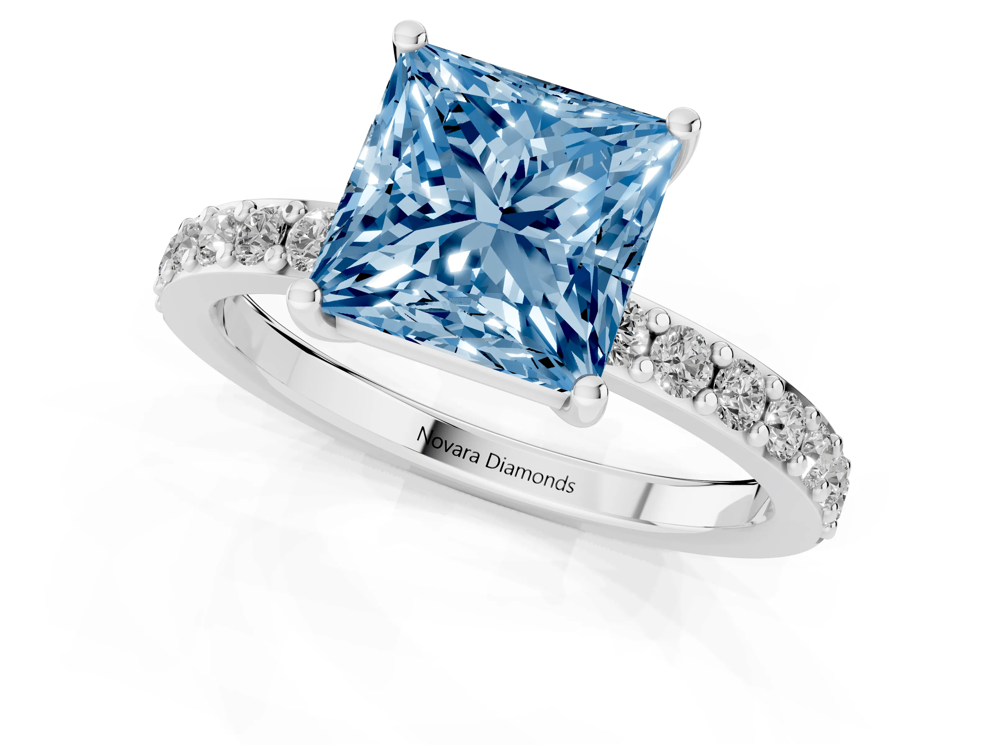 Fancy Blue Princess Cut Diamond Solitaire Set in White gold with Round Pavé Band and Prong Setting