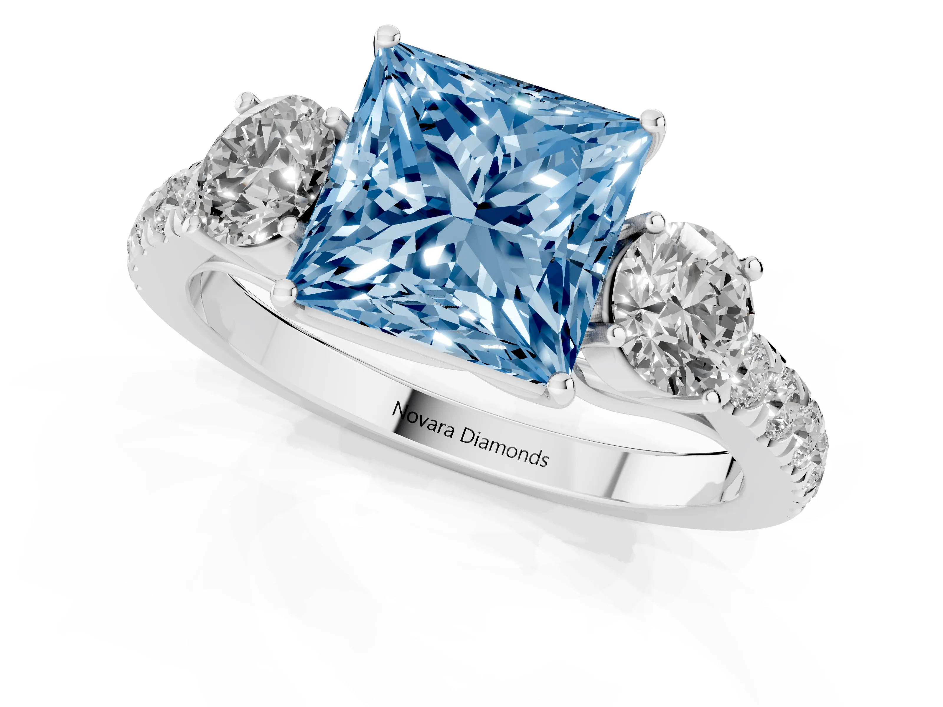 Fancy Blue Princess Cut Diamond Three-Stone Ring Set in Platinum with Round Side Stones and Delicate Pavé Band