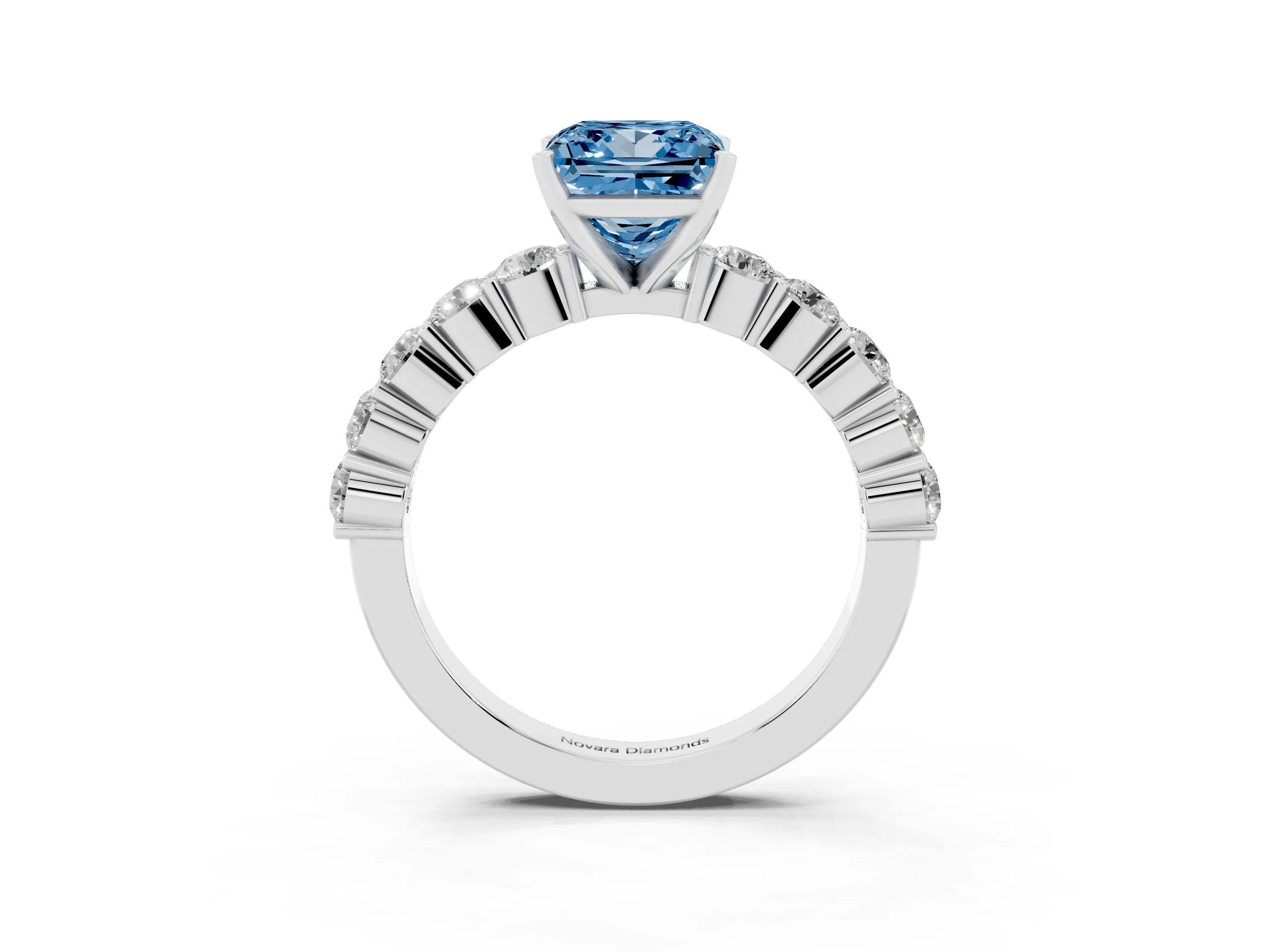 Fancy Blue Princess Cut Diamond Solitaire Ring Set in White gold with Shared Prong Round Side Stones