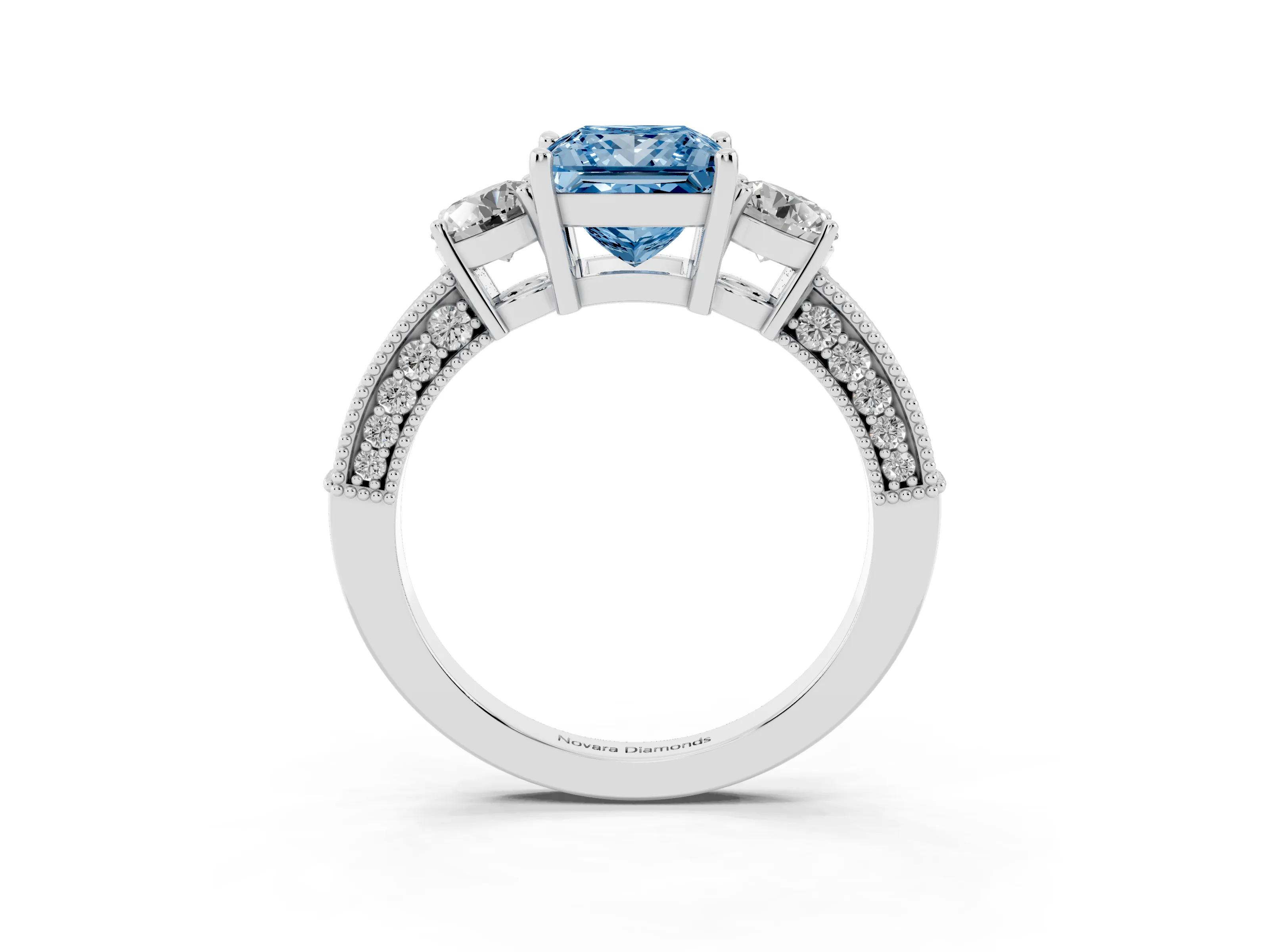 Fancy Blue Princess Cut Diamond Three-Stone Ring Set in White gold with Round Side Stones and Pavé Band