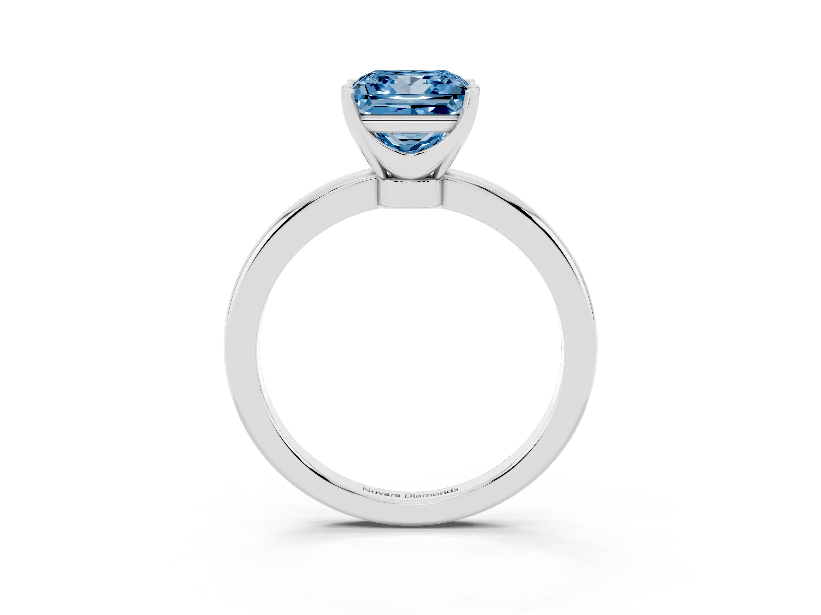 Fancy Blue Princess Cut Diamond Solitaire Ring Set in White gold with Raised Prong Setting on a Classic Band