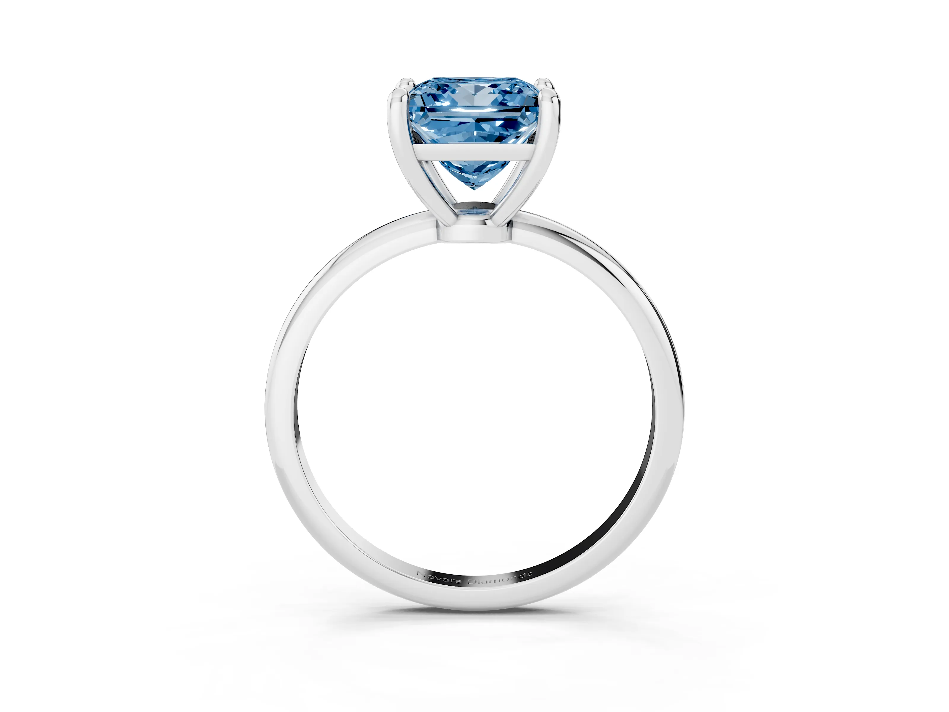 Fancy Blue Princess Cut Diamond Solitaire Ring Set in White gold with Secure Prong Setting on a Classic Band