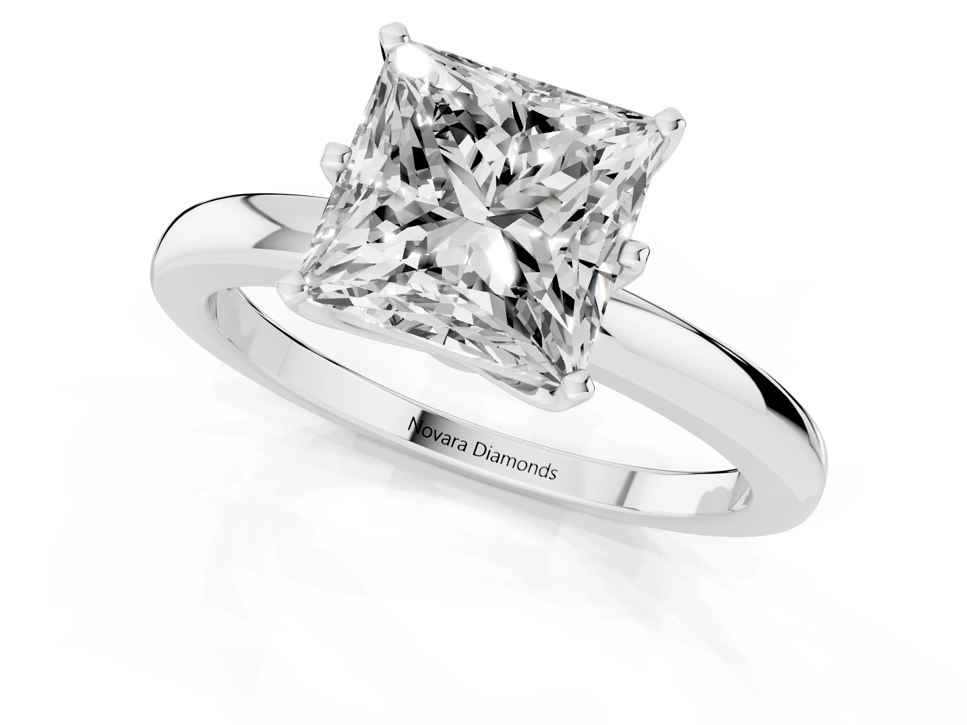 Princess Cut Diamond Solitaire Ring Set in White gold with Raised Prong Setting on a Classic Band