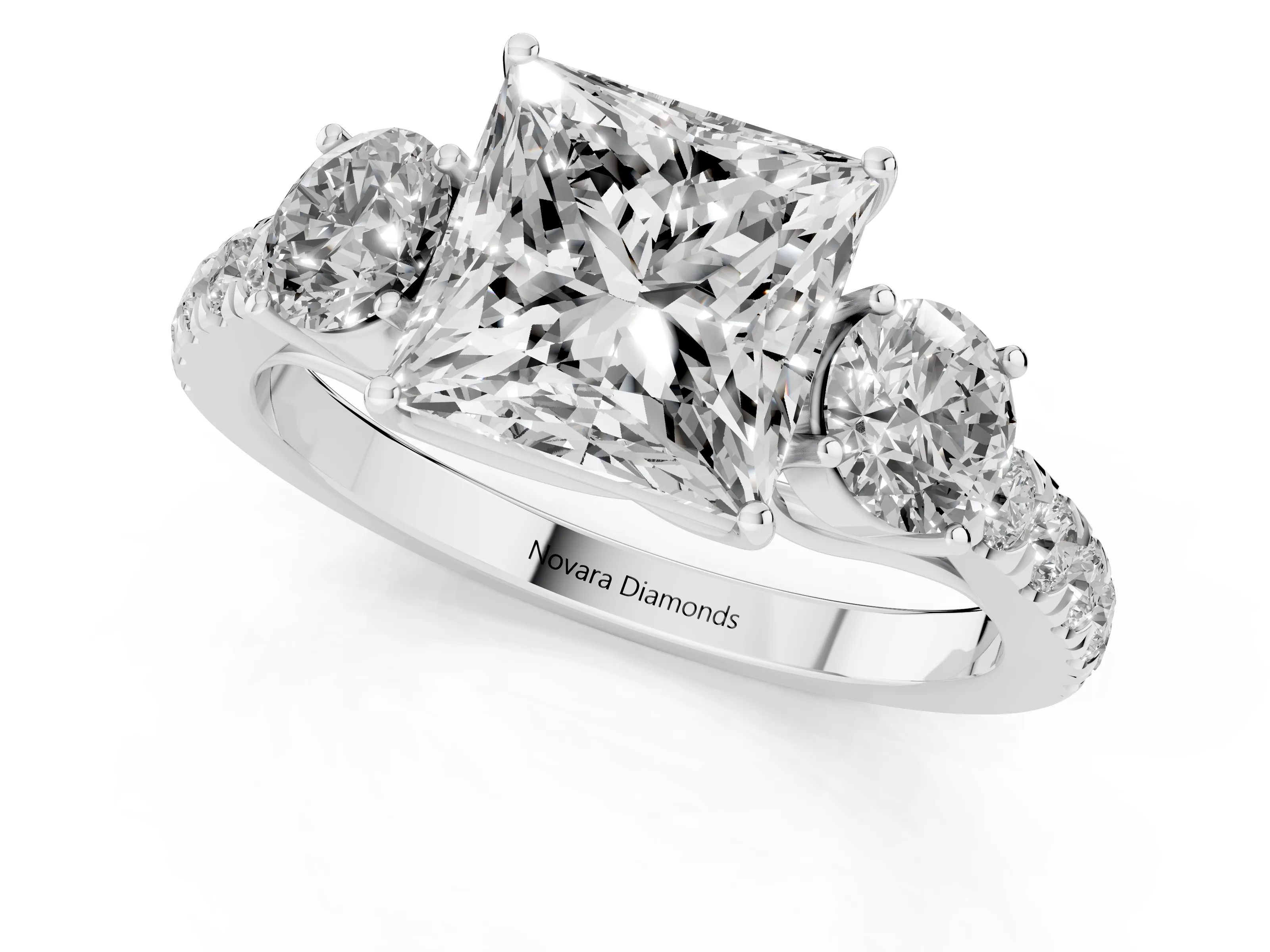 Princess Cut Diamond Three-Stone Ring Set in Platinum with Round Side Stones and Delicate Pavé Band