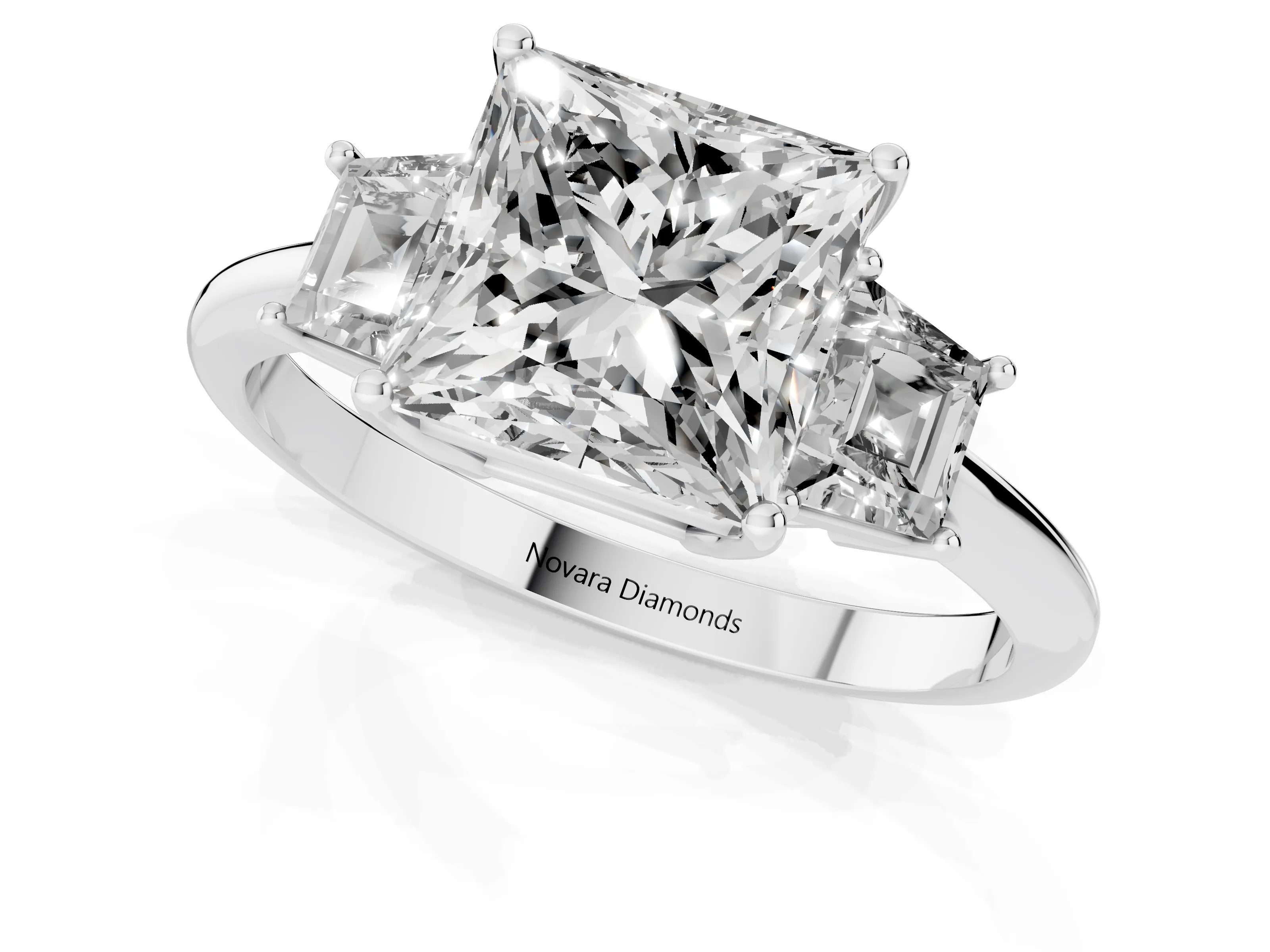 Princess Cut Diamond Three-Stone Ring Set in Platinum with Trapezoid Side Stones and Prong Setting