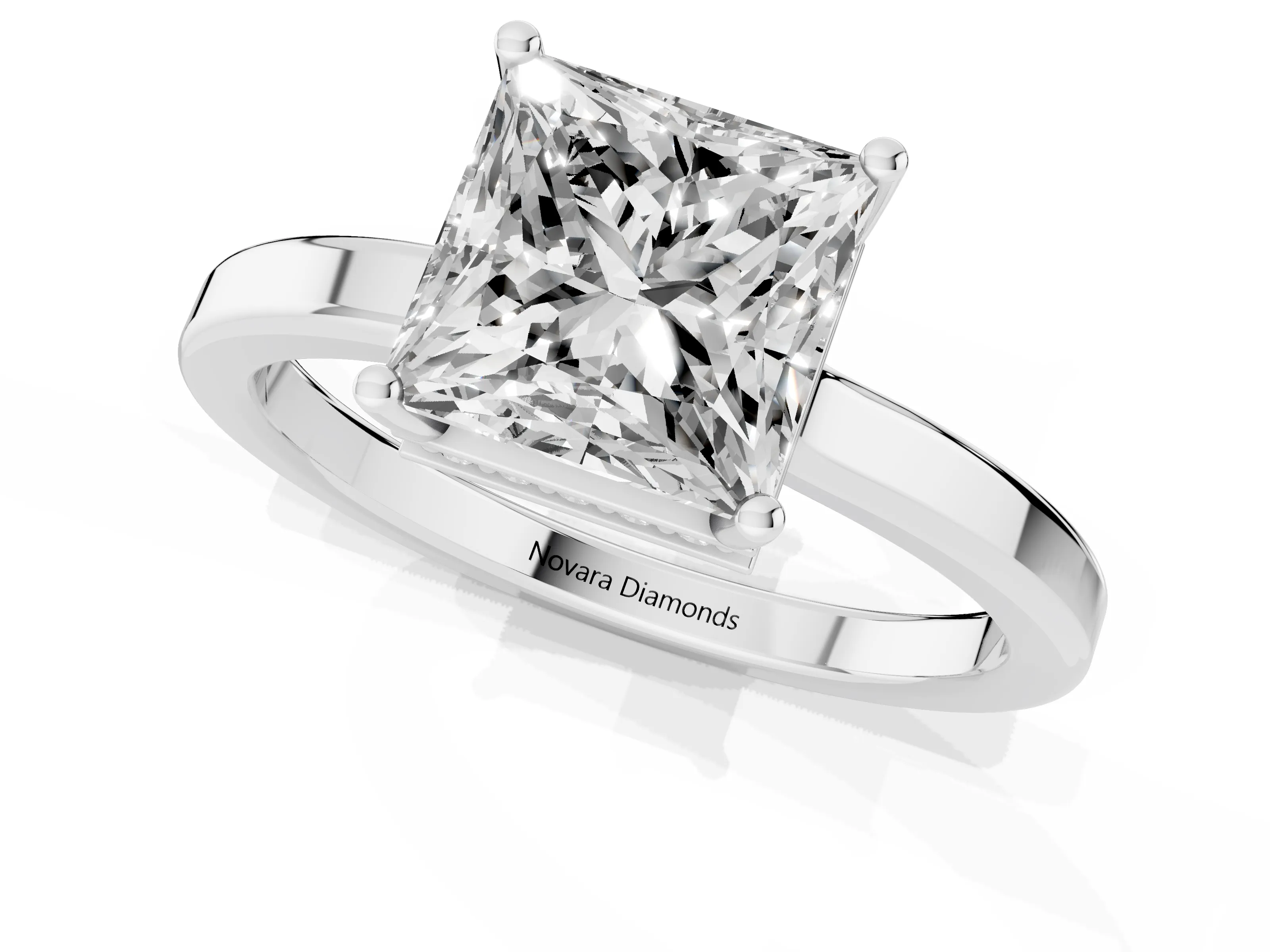 Princess Cut Diamond Solitaire Engagement Ring Set in Silver with Prong Setting on a Plain Band