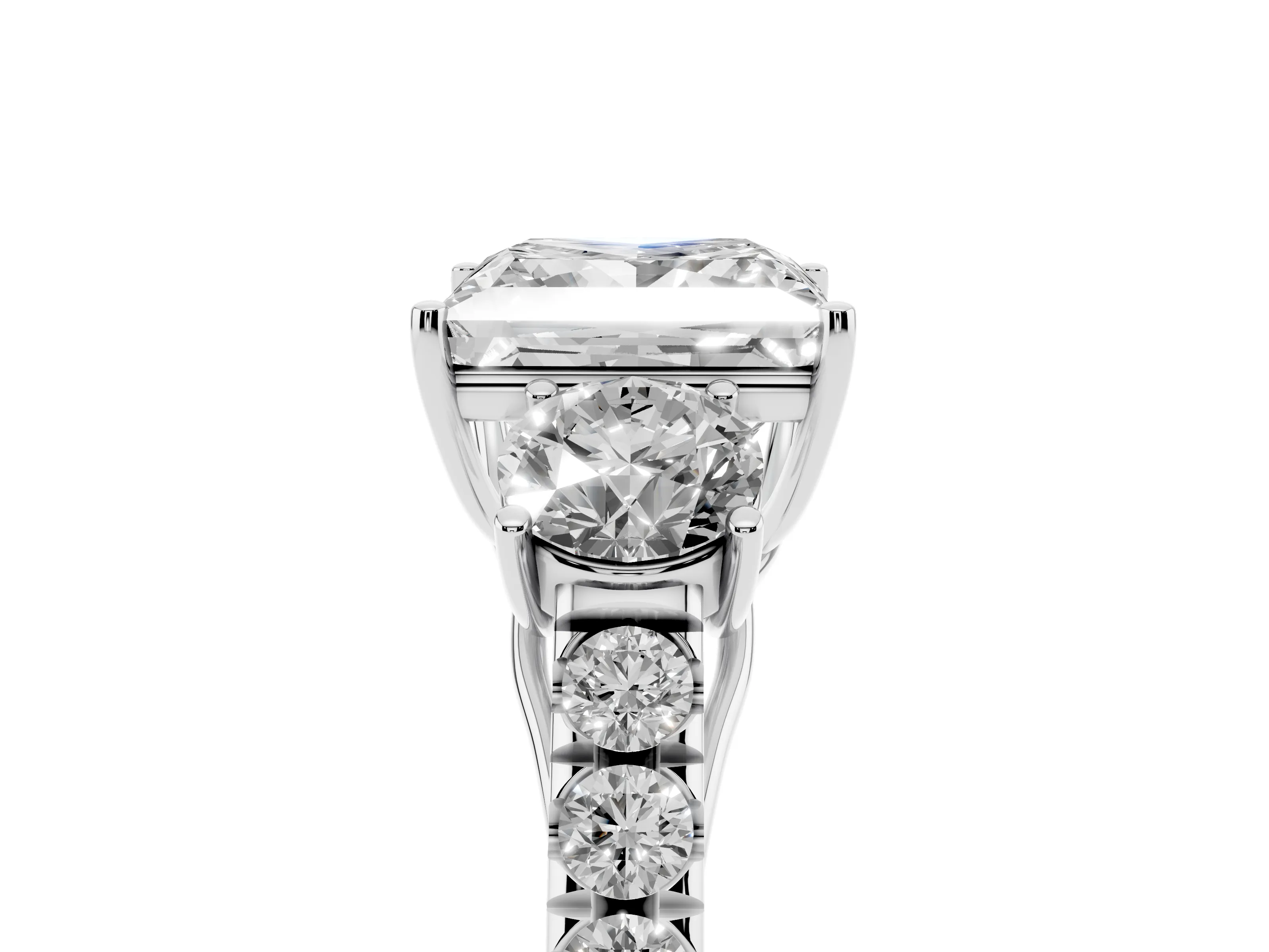 Princess Cut Diamond Three-Stone Ring Set in Platinum with Round Side Stones and Delicate Pavé Band