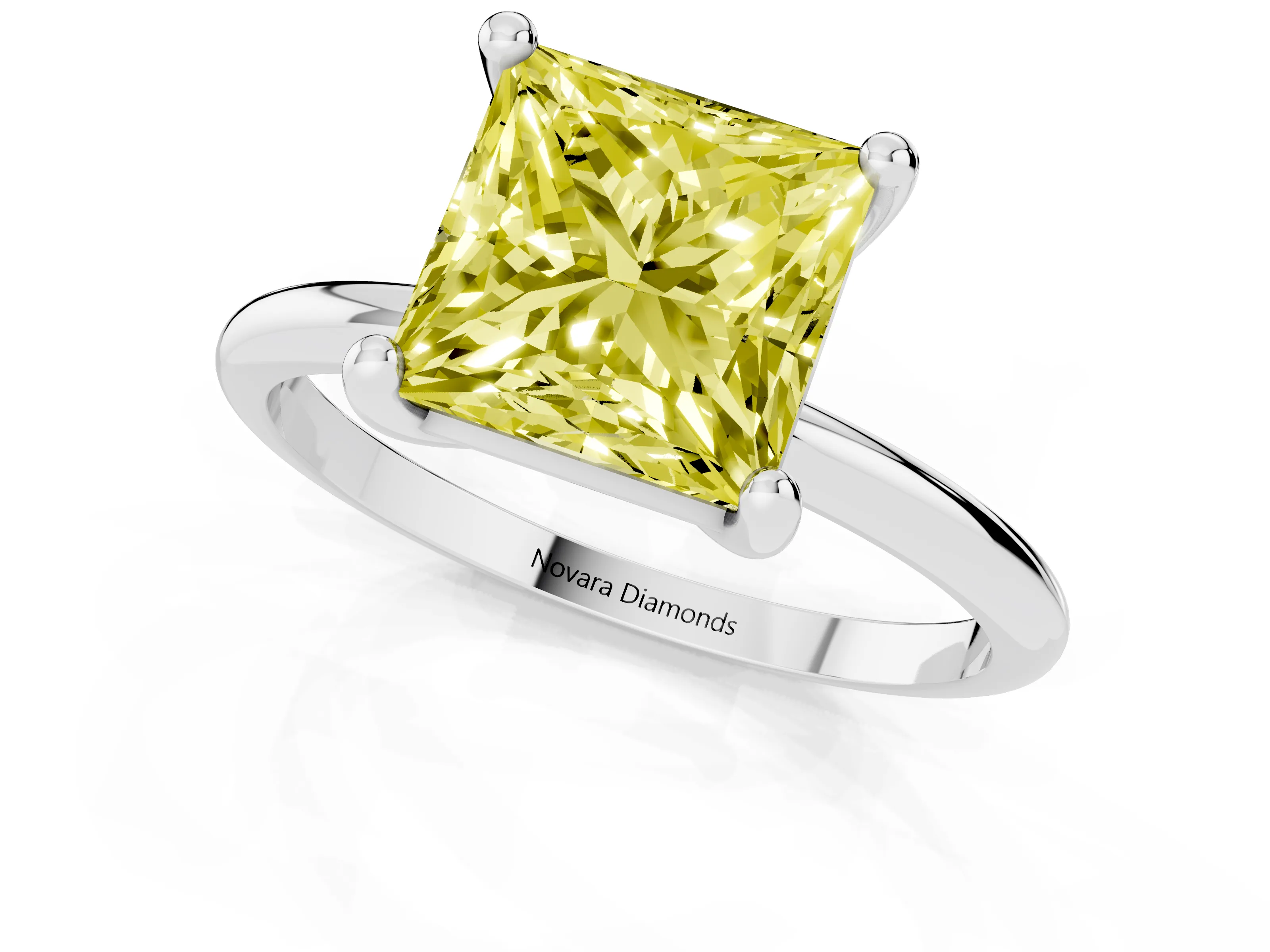 Fancy Yellow Princess Cut Diamond Solitaire Ring Set in White gold with Secure Prong Setting on a Classic Band