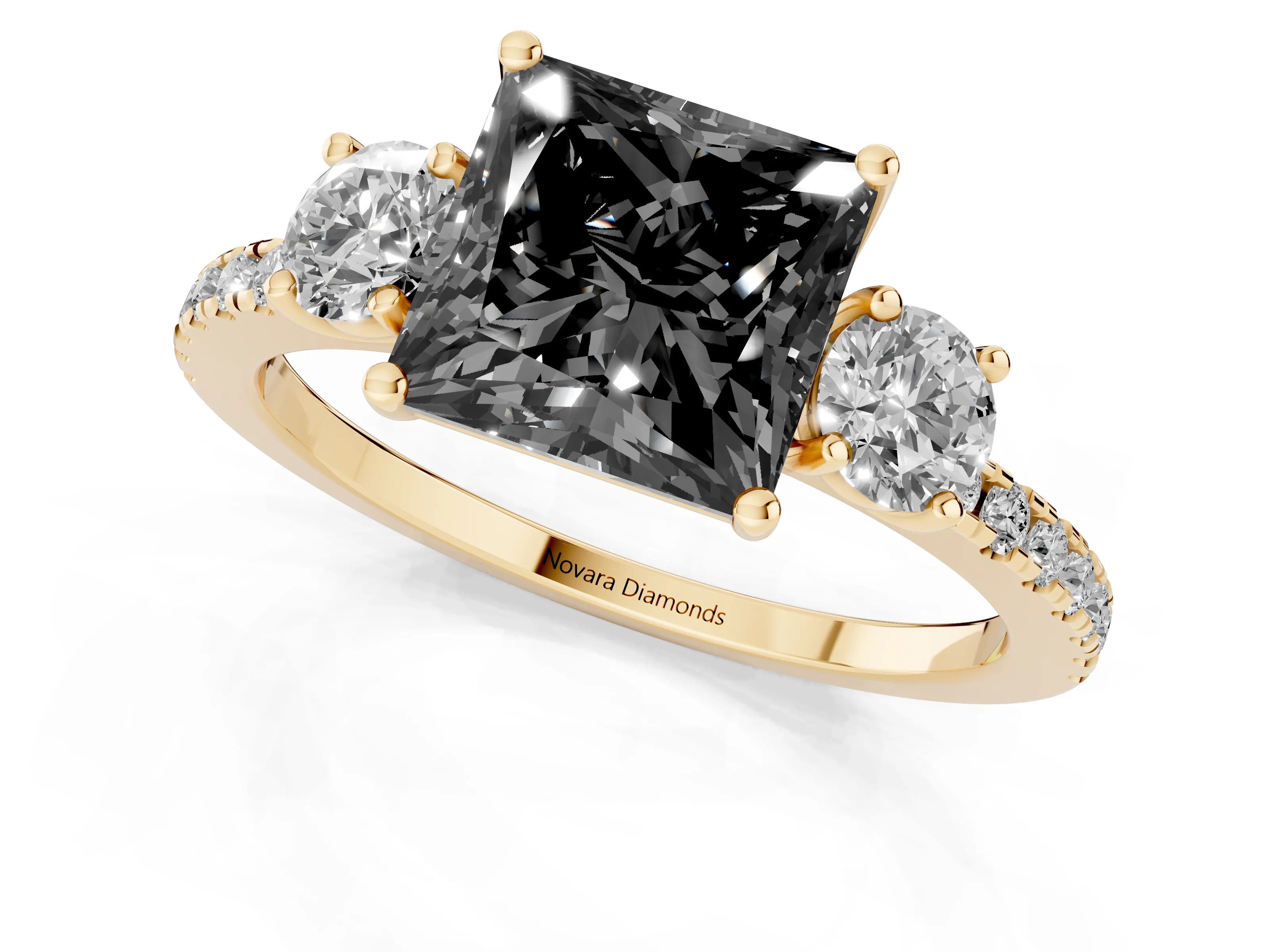 Fancy Black Princess Cut Diamond Three-Stone Ring Set in Yellow gold with Pavé Band and Graduated Sides