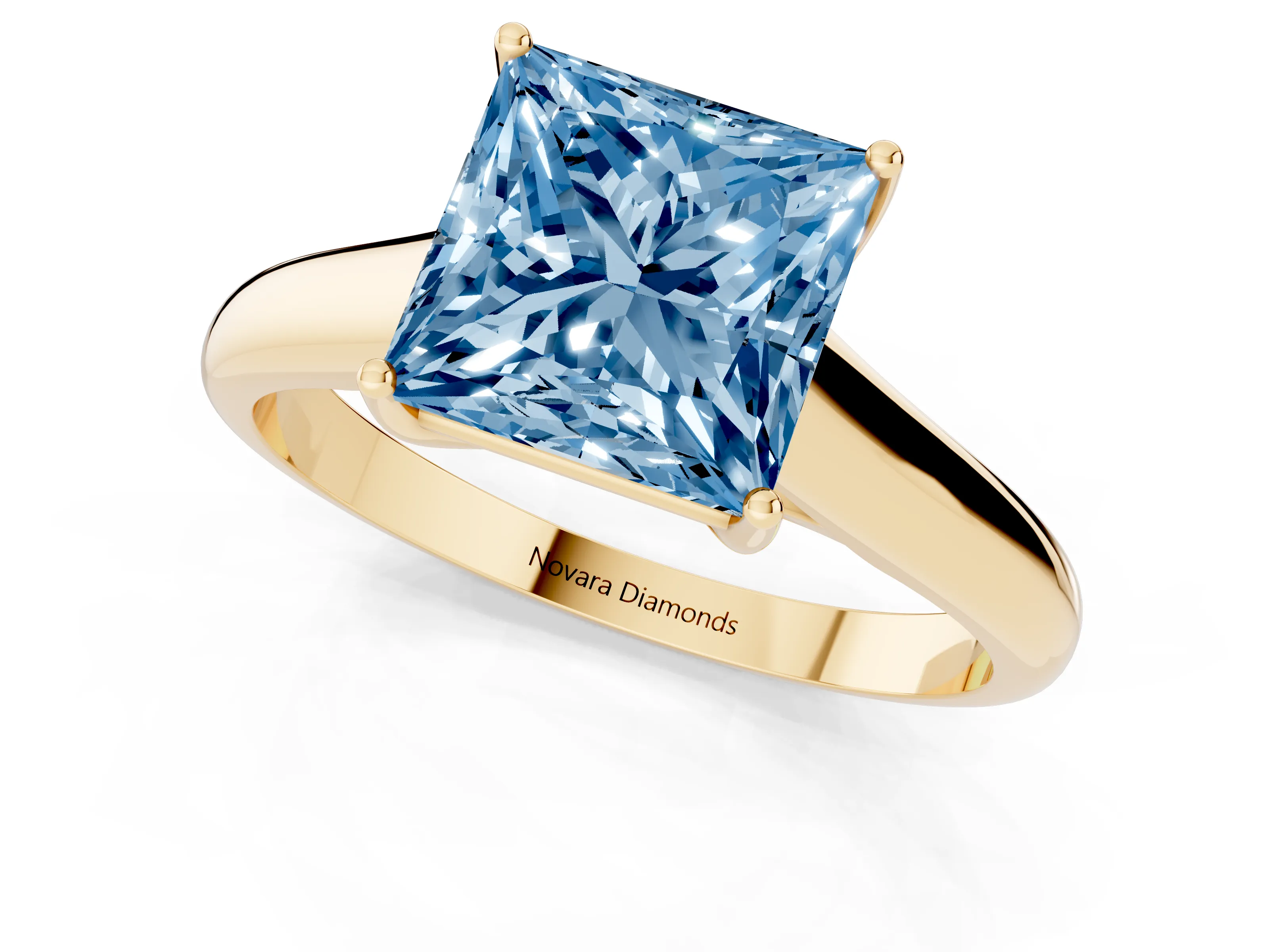 Fancy Blue Princess Cut Diamond Solitaire Engagement Ring Set in Yellow gold with Subtly Tapered Band and Prong Setting