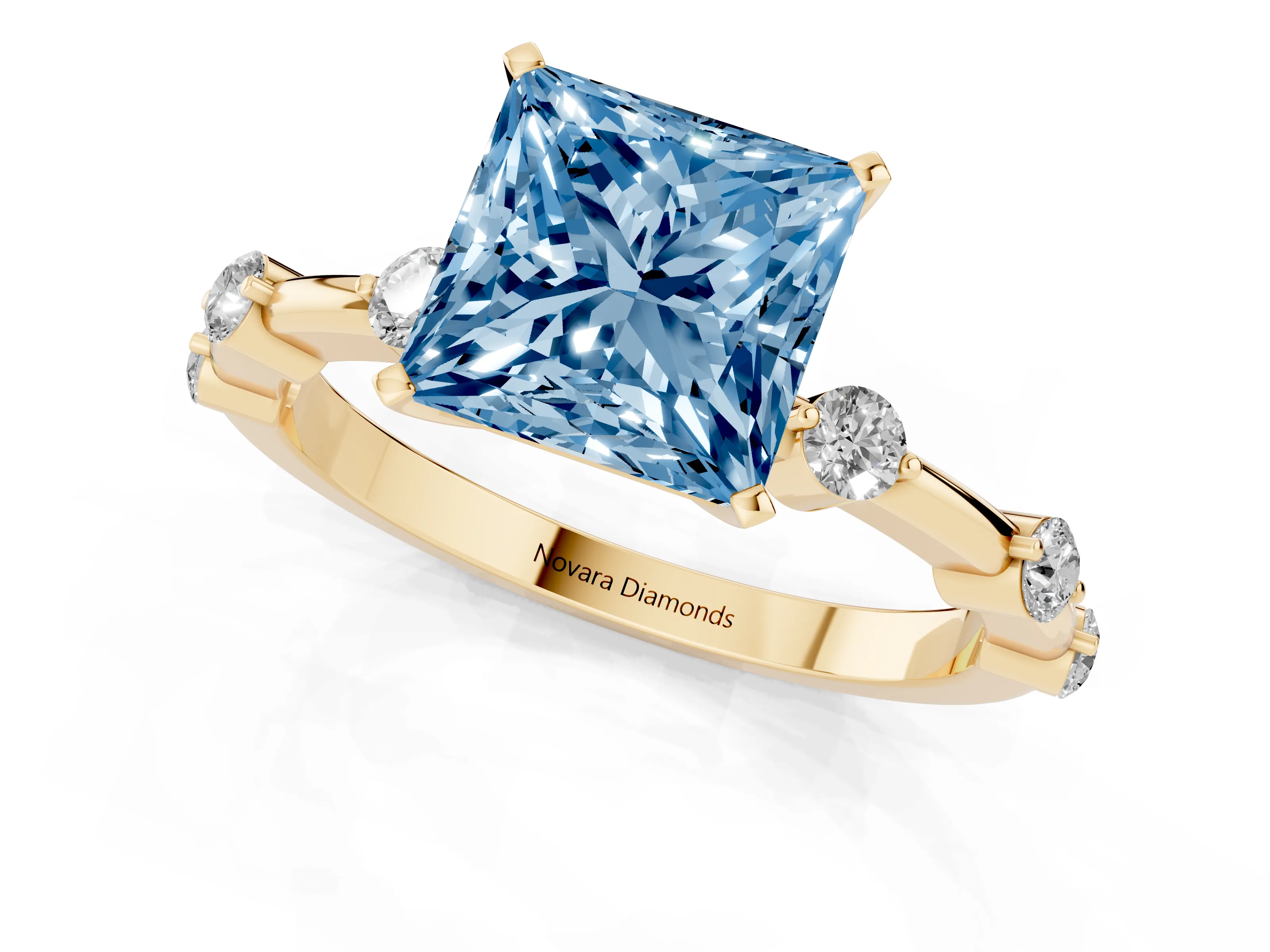 Fancy Blue Princess Cut Diamond Solitaire Ring Set in Yellow gold with Bezel Set Side Stones and Prong Setting