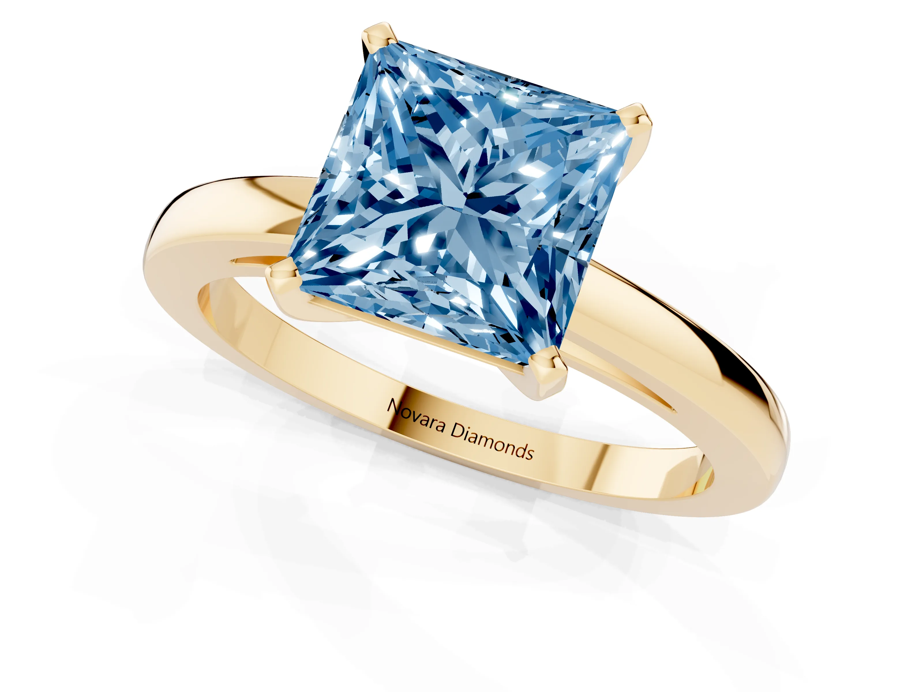 Fancy Blue Princess Cut Diamond Solitaire Engagement Ring Set in Yellow gold with Prong Setting on a Classic Band