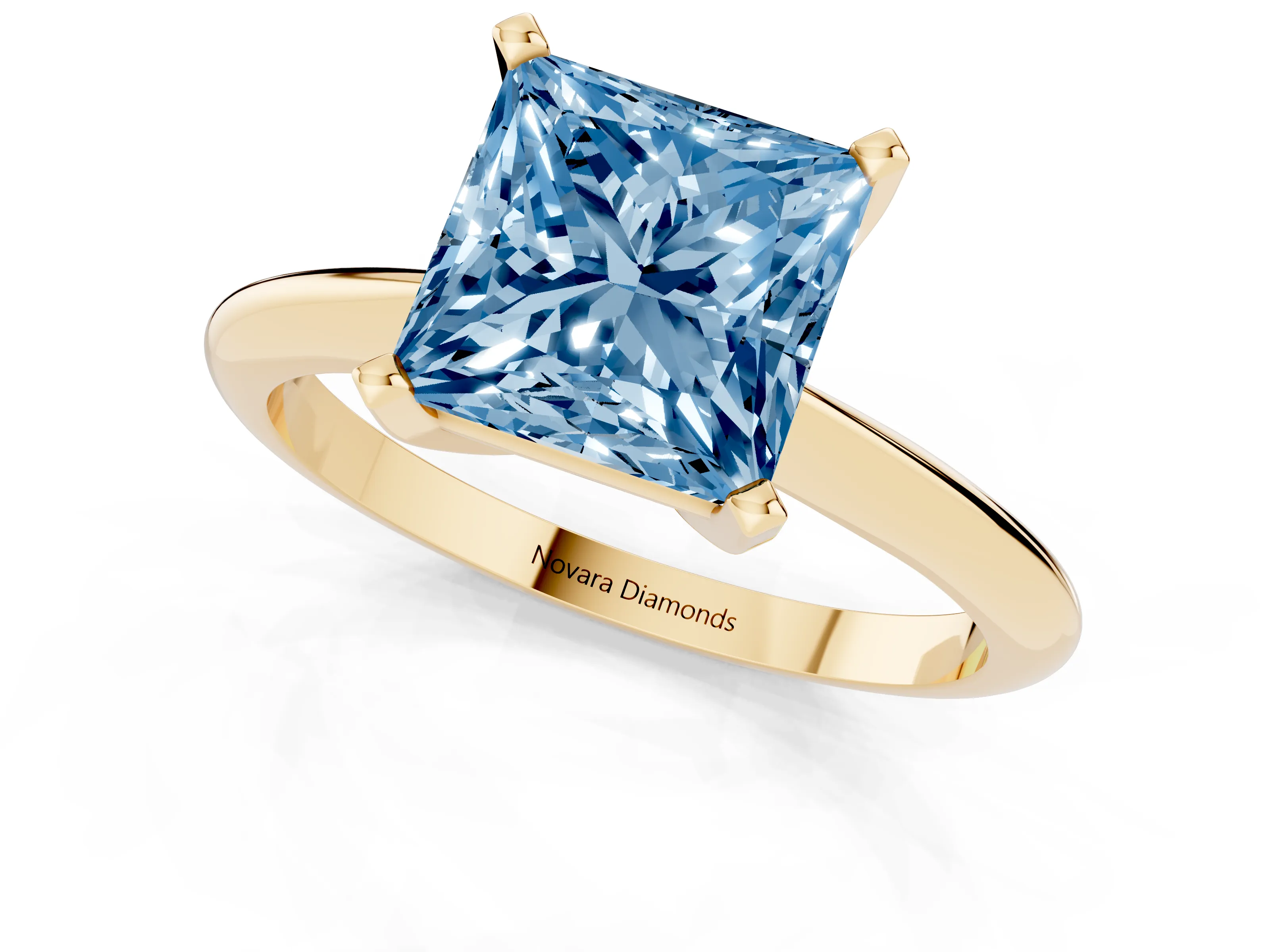 Fancy Blue Princess Cut Diamond Solitaire Ring Set in Yellow gold with Prong Setting on a Plain Round Band