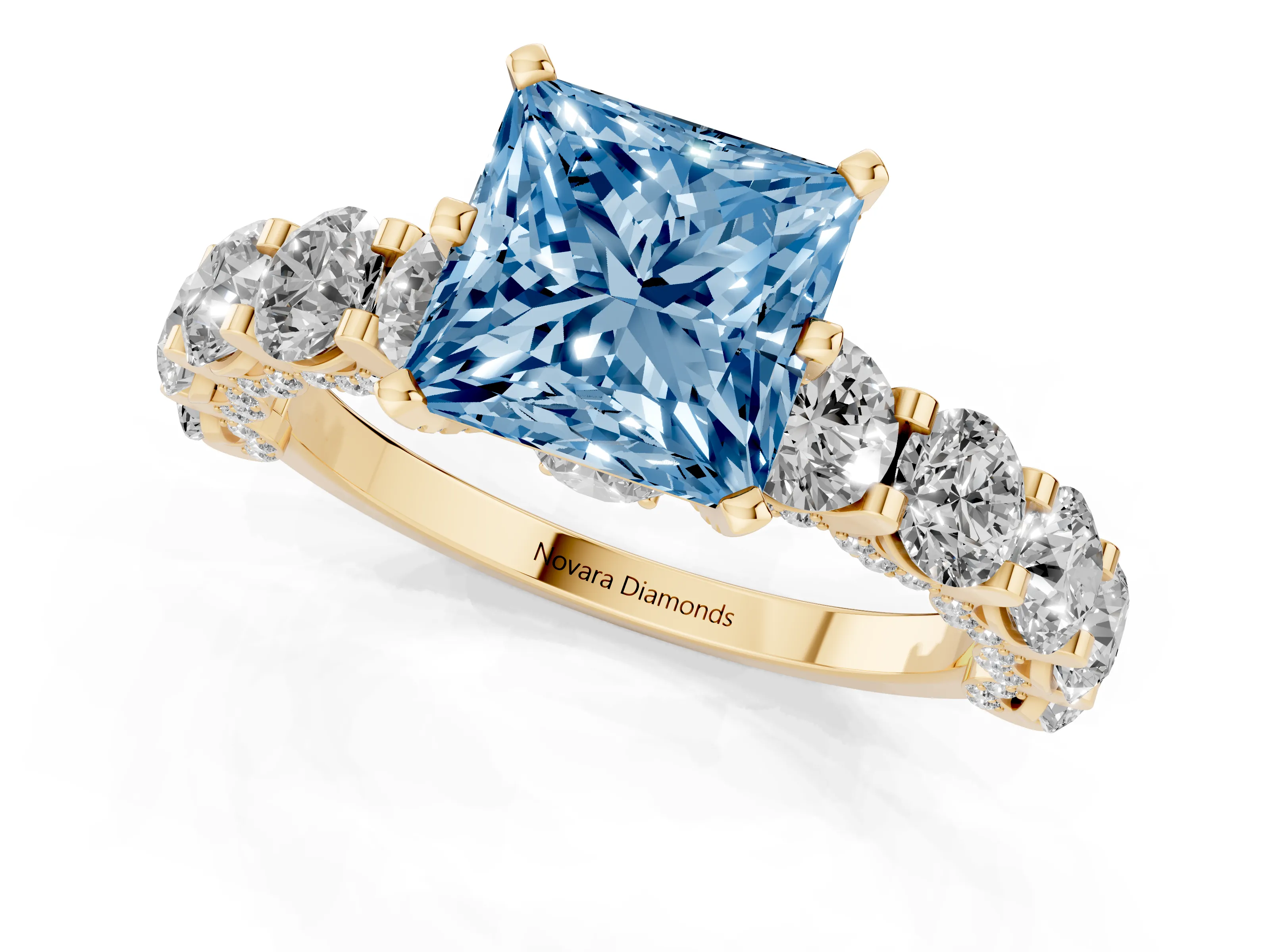 Fancy Blue Princess Cut Diamond Side Stone Ring Set in Yellow gold with Alternating Round and Oval Side Stones