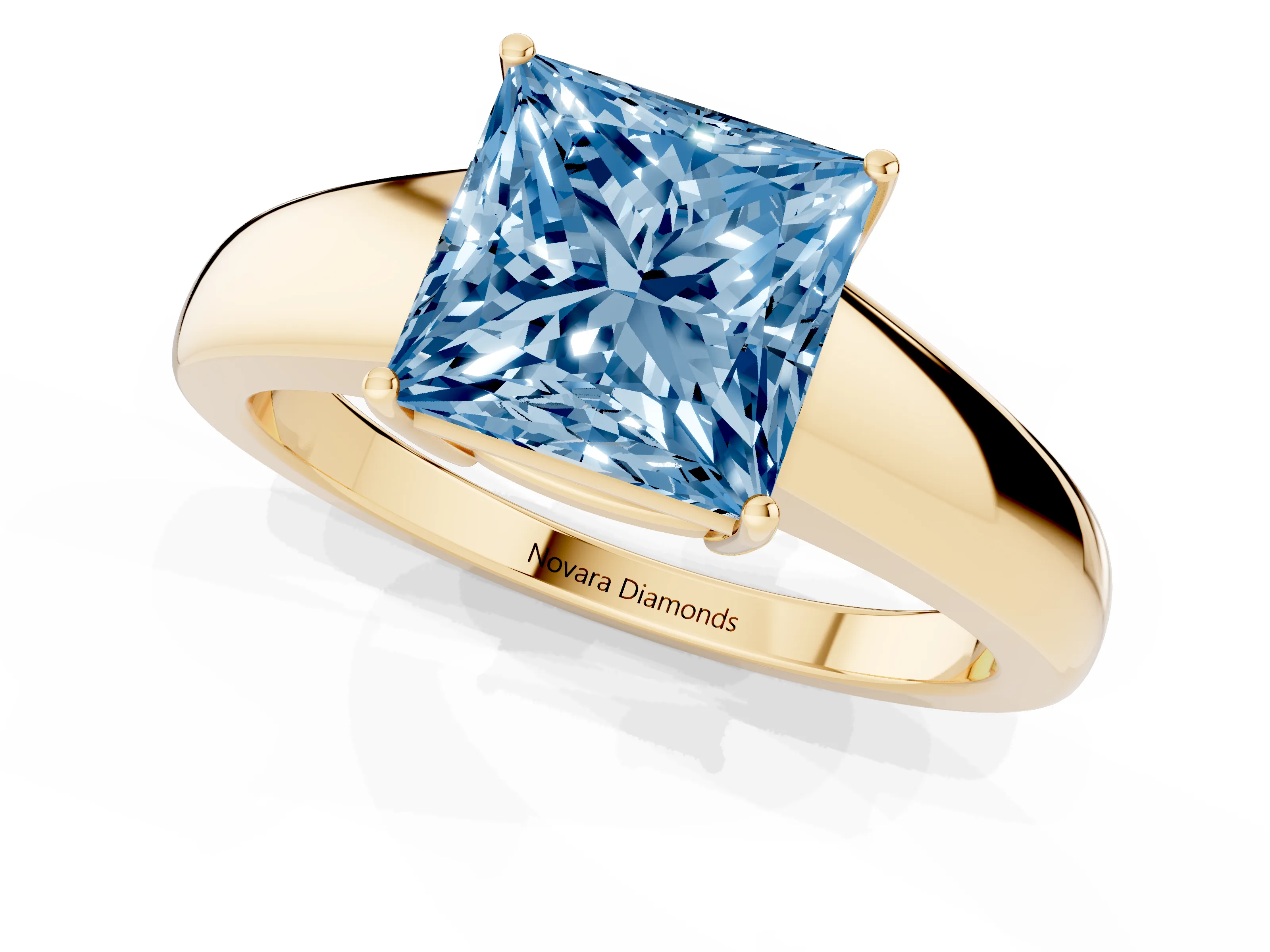 Fancy Blue Princess Cut Diamond Solitaire Ring Set in Yellow gold with Tapered Band and Prong Setting