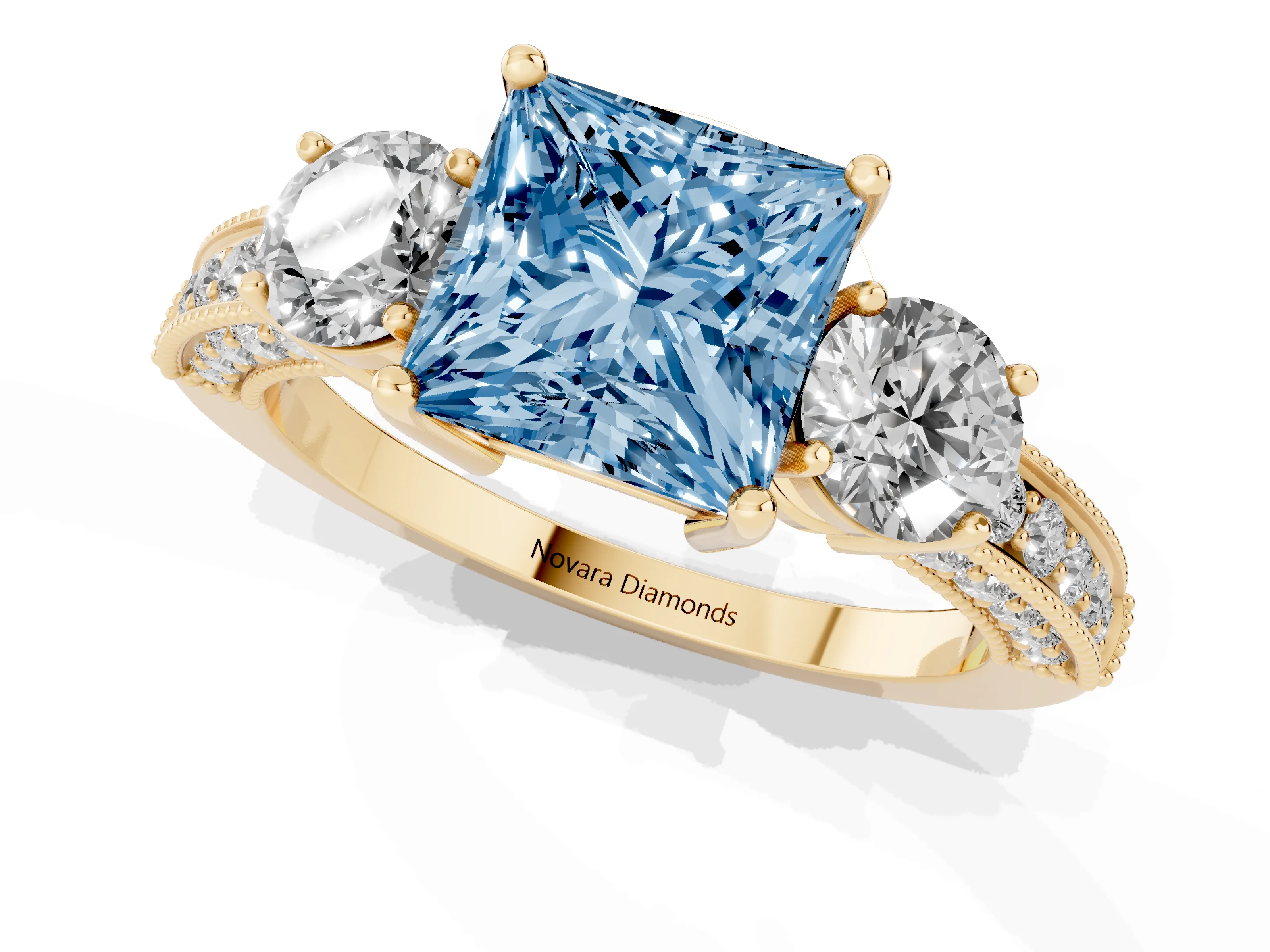 Fancy Blue Princess Cut Diamond Three-Stone Ring Set in Yellow gold with Round Side Stones and Pavé Band